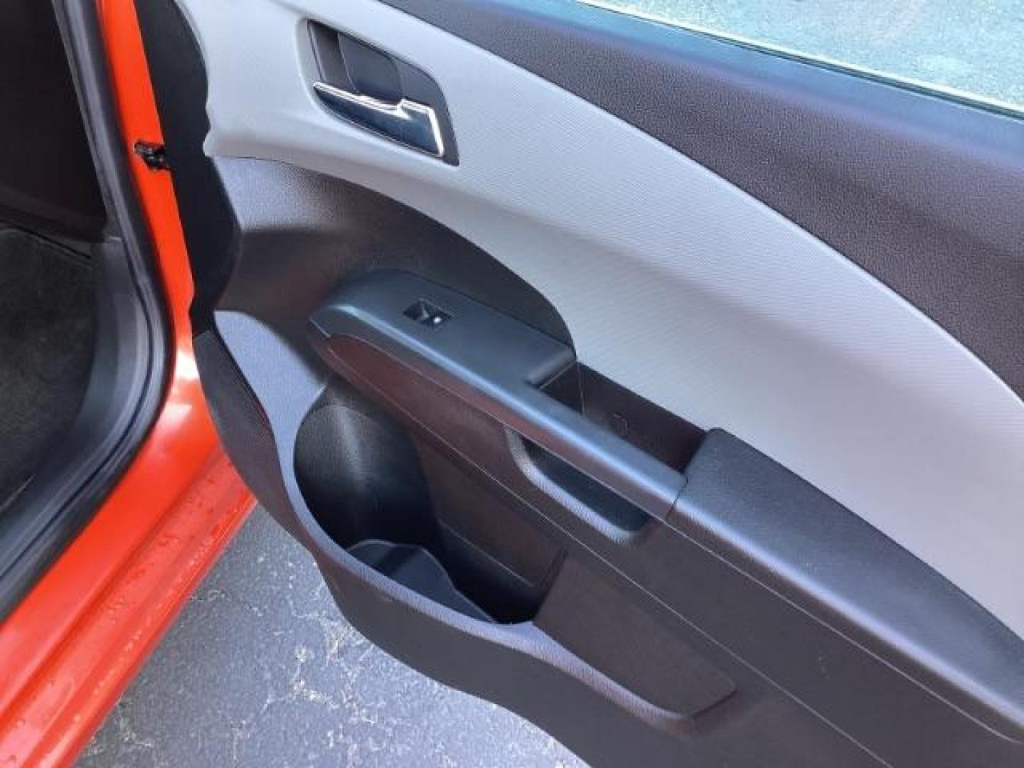 2012 Inferno Orange Metallic /Jet Blk/ Dark Titanium Cloth Interior Chevrolet Sonic 1LT 5-Door (1G1JD6SB5C4) with an 1.4L L4 DOHC 24V TURBO engine, 5-Speed Manual transmission, located at 1235 N Woodruff Ave., Idaho Falls, 83401, (208) 523-1053, 43.507172, -112.000488 - Get ready to enjoy a spirited drive with this 2012 Chevrolet Sonic Hatchback 1LT! Equipped with a peppy 1.4L turbocharged engine, this compact hatchback delivers impressive fuel efficiency without sacrificing performance. Perfect for urban commuting or weekend getaways, the Sonic combines style and - Photo#23