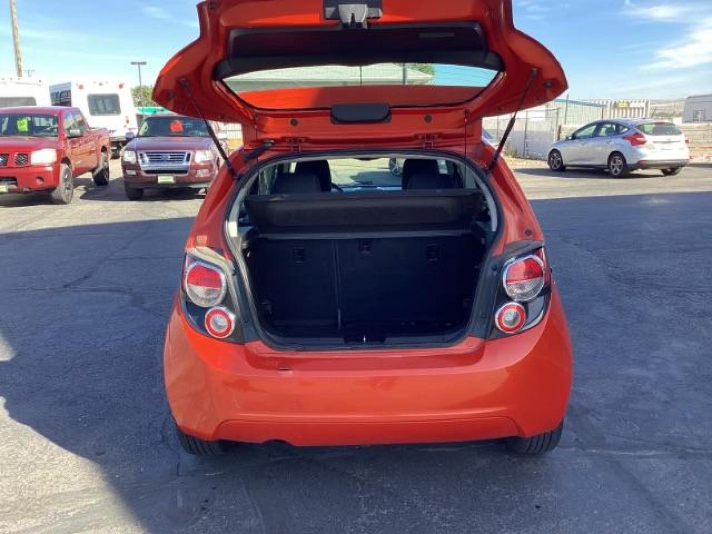 2012 Inferno Orange Metallic /Jet Blk/ Dark Titanium Cloth Interior Chevrolet Sonic 1LT 5-Door (1G1JD6SB5C4) with an 1.4L L4 DOHC 24V TURBO engine, 5-Speed Manual transmission, located at 1235 N Woodruff Ave., Idaho Falls, 83401, (208) 523-1053, 43.507172, -112.000488 - Get ready to enjoy a spirited drive with this 2012 Chevrolet Sonic Hatchback 1LT! Equipped with a peppy 1.4L turbocharged engine, this compact hatchback delivers impressive fuel efficiency without sacrificing performance. Perfect for urban commuting or weekend getaways, the Sonic combines style and - Photo#24