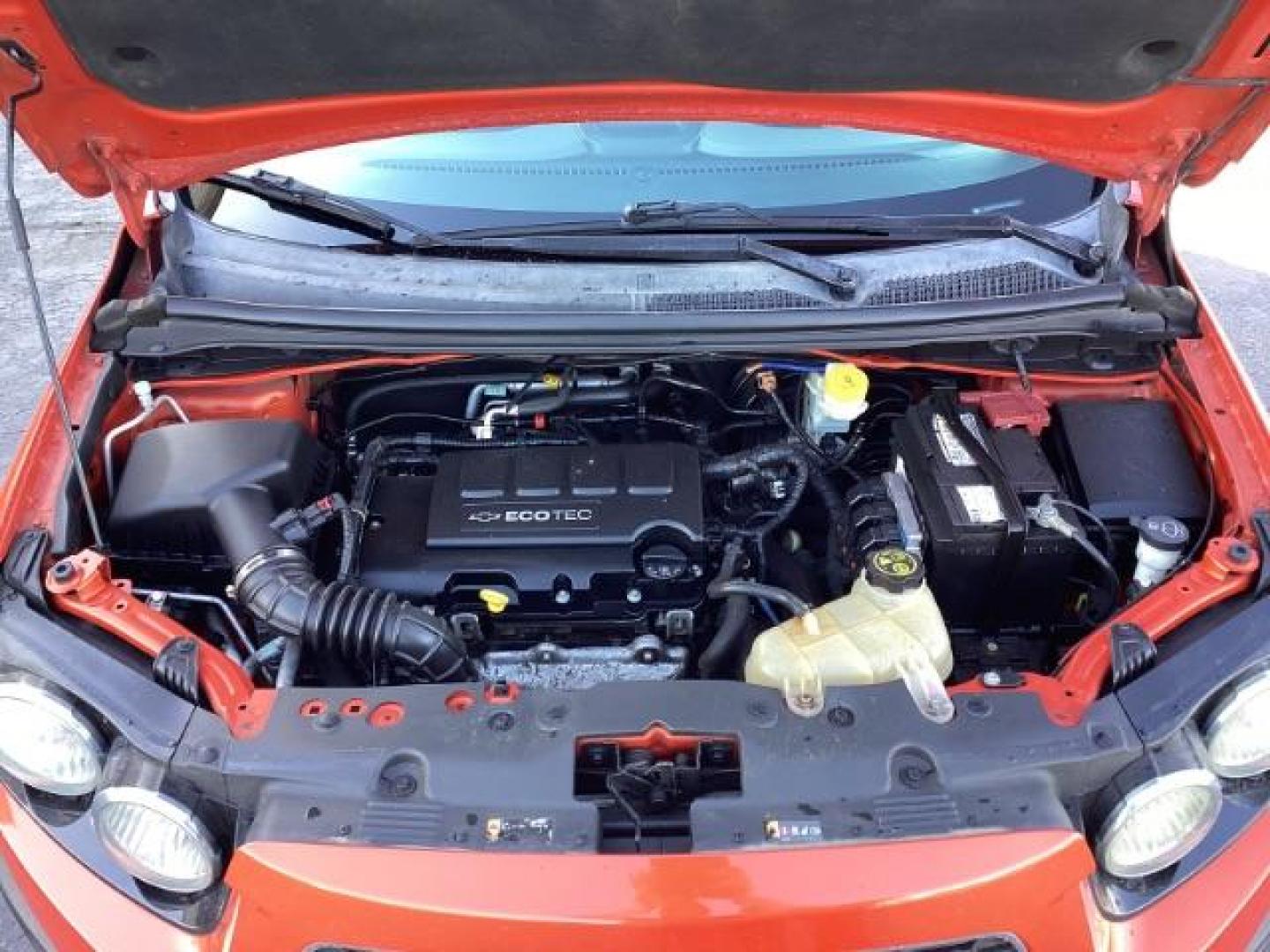2012 Inferno Orange Metallic /Jet Blk/ Dark Titanium Cloth Interior Chevrolet Sonic 1LT 5-Door (1G1JD6SB5C4) with an 1.4L L4 DOHC 24V TURBO engine, 5-Speed Manual transmission, located at 1235 N Woodruff Ave., Idaho Falls, 83401, (208) 523-1053, 43.507172, -112.000488 - Get ready to enjoy a spirited drive with this 2012 Chevrolet Sonic Hatchback 1LT! Equipped with a peppy 1.4L turbocharged engine, this compact hatchback delivers impressive fuel efficiency without sacrificing performance. Perfect for urban commuting or weekend getaways, the Sonic combines style and - Photo#25