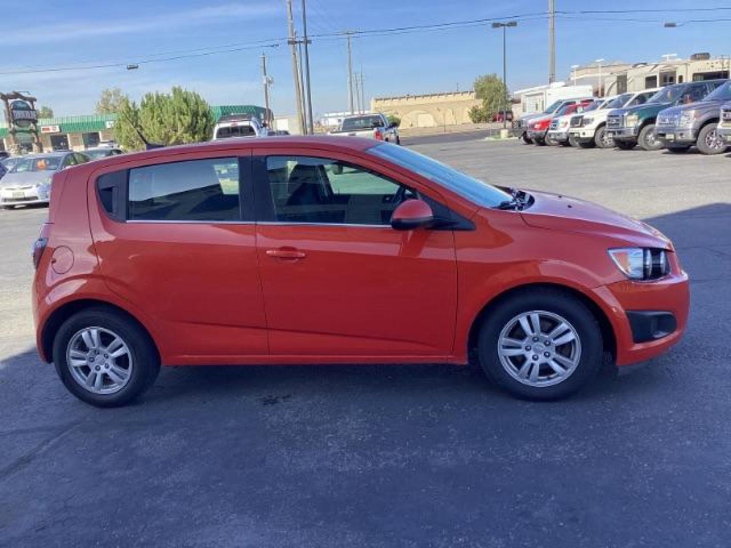 2012 Inferno Orange Metallic /Jet Blk/ Dark Titanium Cloth Interior Chevrolet Sonic 1LT 5-Door (1G1JD6SB5C4) with an 1.4L L4 DOHC 24V TURBO engine, 5-Speed Manual transmission, located at 1235 N Woodruff Ave., Idaho Falls, 83401, (208) 523-1053, 43.507172, -112.000488 - Get ready to enjoy a spirited drive with this 2012 Chevrolet Sonic Hatchback 1LT! Equipped with a peppy 1.4L turbocharged engine, this compact hatchback delivers impressive fuel efficiency without sacrificing performance. Perfect for urban commuting or weekend getaways, the Sonic combines style and - Photo#6