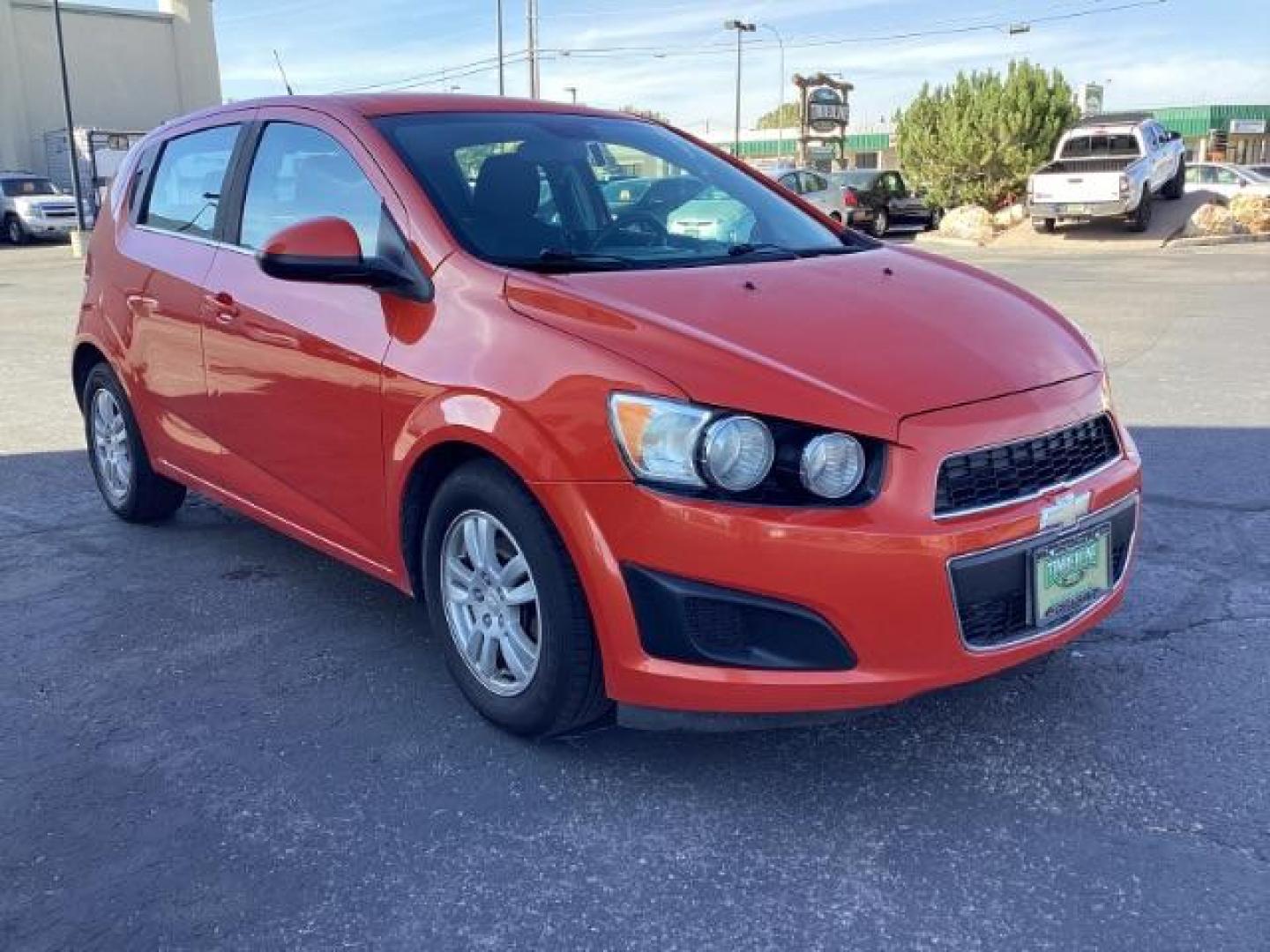 2012 Inferno Orange Metallic /Jet Blk/ Dark Titanium Cloth Interior Chevrolet Sonic 1LT 5-Door (1G1JD6SB5C4) with an 1.4L L4 DOHC 24V TURBO engine, 5-Speed Manual transmission, located at 1235 N Woodruff Ave., Idaho Falls, 83401, (208) 523-1053, 43.507172, -112.000488 - Get ready to enjoy a spirited drive with this 2012 Chevrolet Sonic Hatchback 1LT! Equipped with a peppy 1.4L turbocharged engine, this compact hatchback delivers impressive fuel efficiency without sacrificing performance. Perfect for urban commuting or weekend getaways, the Sonic combines style and - Photo#7