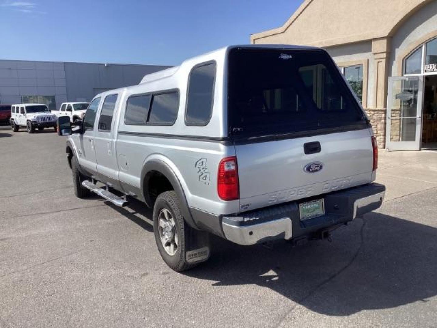 2012 Ingot Silver Metallic /Black Leather Interior Ford F-350 SD Lariat Crew Cab Long Bed 4WD (1FT8W3BT4CE) with an 6.7L V8 OHV 16V DIESEL engine, 6-Speed Automatic transmission, located at 1235 N Woodruff Ave., Idaho Falls, 83401, (208) 523-1053, 43.507172, -112.000488 - At Timberline Auto, finding a great deal on your next vehicle is always easy! Our experienced sales staff's goal is to help find you the right vehicle at the right price! Our knowledgeable finance department has options for almost any credit score. We offer extended service contract options to prote - Photo#3