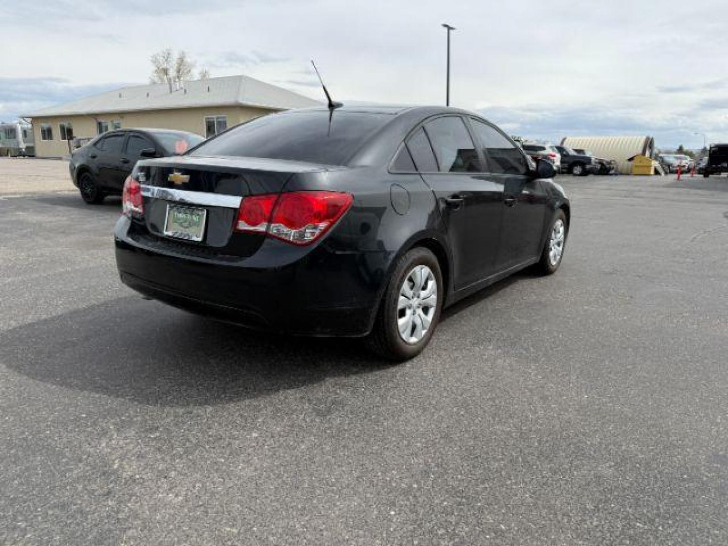 2014 Black Granite Metallic /Jet Black/Medium Titanium Chevrolet Cruze LS Auto (1G1PA5SH5E7) with an 1.8L L4 DOHC 16V FFV engine, 6-Speed Automatic transmission, located at 1235 N Woodruff Ave., Idaho Falls, 83401, (208) 523-1053, 43.507172, -112.000488 - At Timberline Auto, finding a great deal on your next vehicle is always easy! Our experienced sales staff's goal is to help find you the right vehicle at the right price! Our knowledgeable finance department has options for almost any credit score. We offer extended service contract options to prote - Photo#4