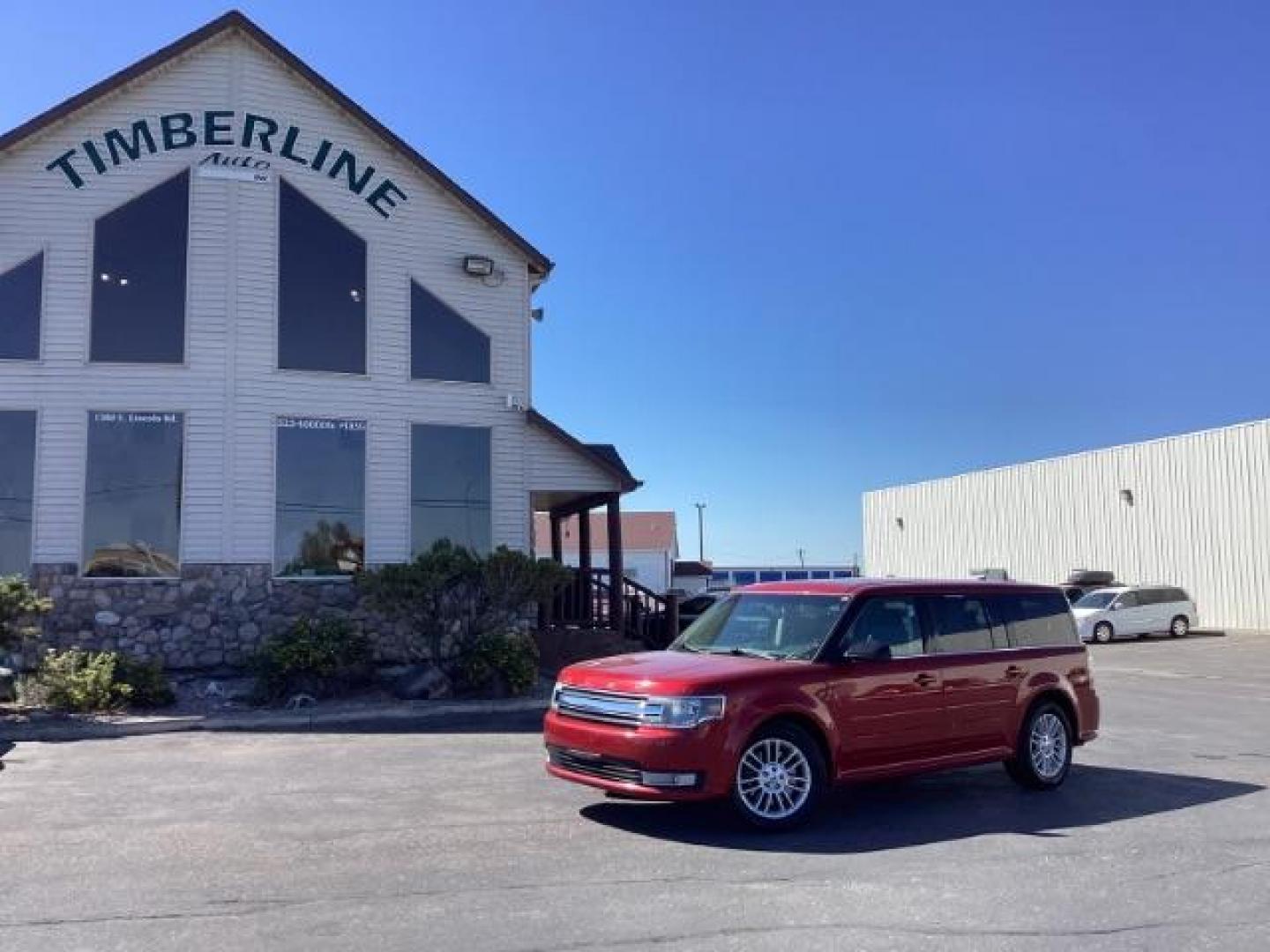 2014 Ruby Red Met Tinted CC Ford Flex SEL AWD (2FMHK6C82EB) with an 3.5L V6 DOHC 24V engine, 6-Speed Automatic Overdrive transmission, located at 1235 N Woodruff Ave., Idaho Falls, 83401, (208) 523-1053, 43.507172, -112.000488 - Photo#0