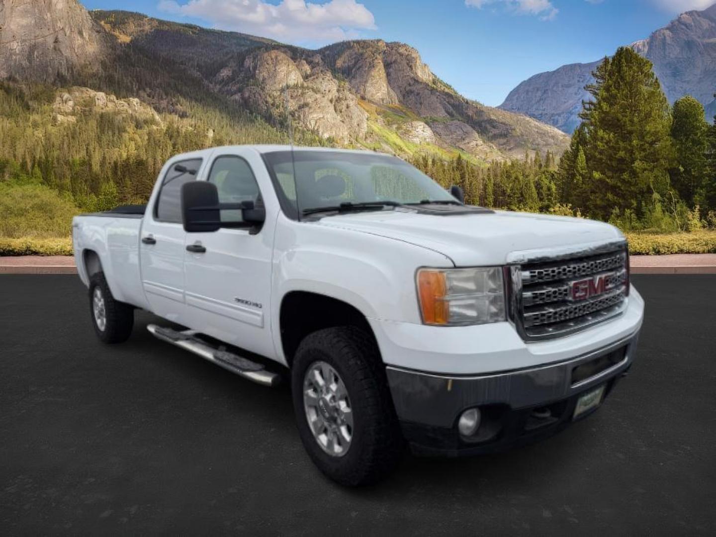 2013 Summit White /Ebony Cloth Interior GMC Sierra 3500HD (1GT423C80DF) with an 66L V8 32V OHV DIESEL engine, Automatic transmission, located at 1175 N Woodruff Ave, Idaho Falls, ID, 83401, 43.506901, -111.999657 - At Timberline Auto, finding a great deal on your next vehicle is always easy! Our experienced sales staff's goal is to help find you the right vehicle at the right price! Our knowledgeable finance department has options for almost any credit score. We offer extended service contract options to prote - Photo#6