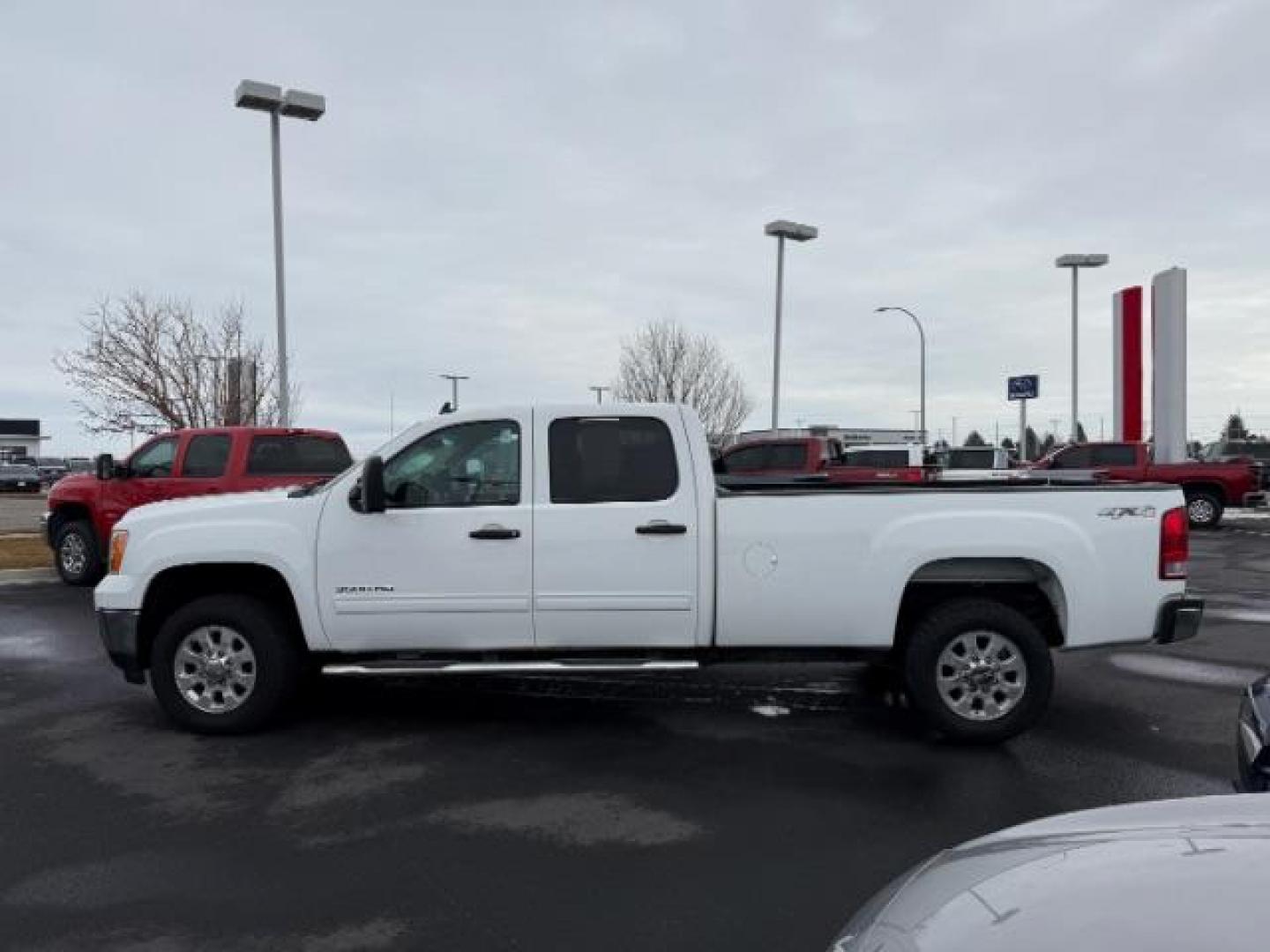 2013 Summit White /Ebony Cloth Interior GMC Sierra 3500HD SLE Crew Cab Long Box 4WD (1GT423C80DF) with an 6.6L V8 32V OHV DIESEL engine, 6-Speed Automatic transmission, located at 1235 N Woodruff Ave., Idaho Falls, 83401, (208) 523-1053, 43.507172, -112.000488 - At Timberline Auto, finding a great deal on your next vehicle is always easy! Our experienced sales staff's goal is to help find you the right vehicle at the right price! Our knowledgeable finance department has options for almost any credit score. We offer extended service contract options to prote - Photo#1