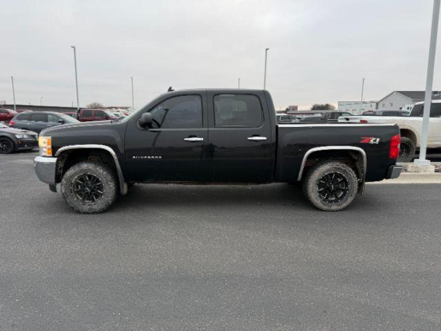 2013 Black /Ebony Cloth Interior Chevrolet Silverado 1500 (3GCPKSE74DG) with an 53L V8 OHV 16V FFV engine, Automatic transmission, located at 1175 N Woodruff Ave, Idaho Falls, ID, 83401, 43.506901, -111.999657 - Photo#1