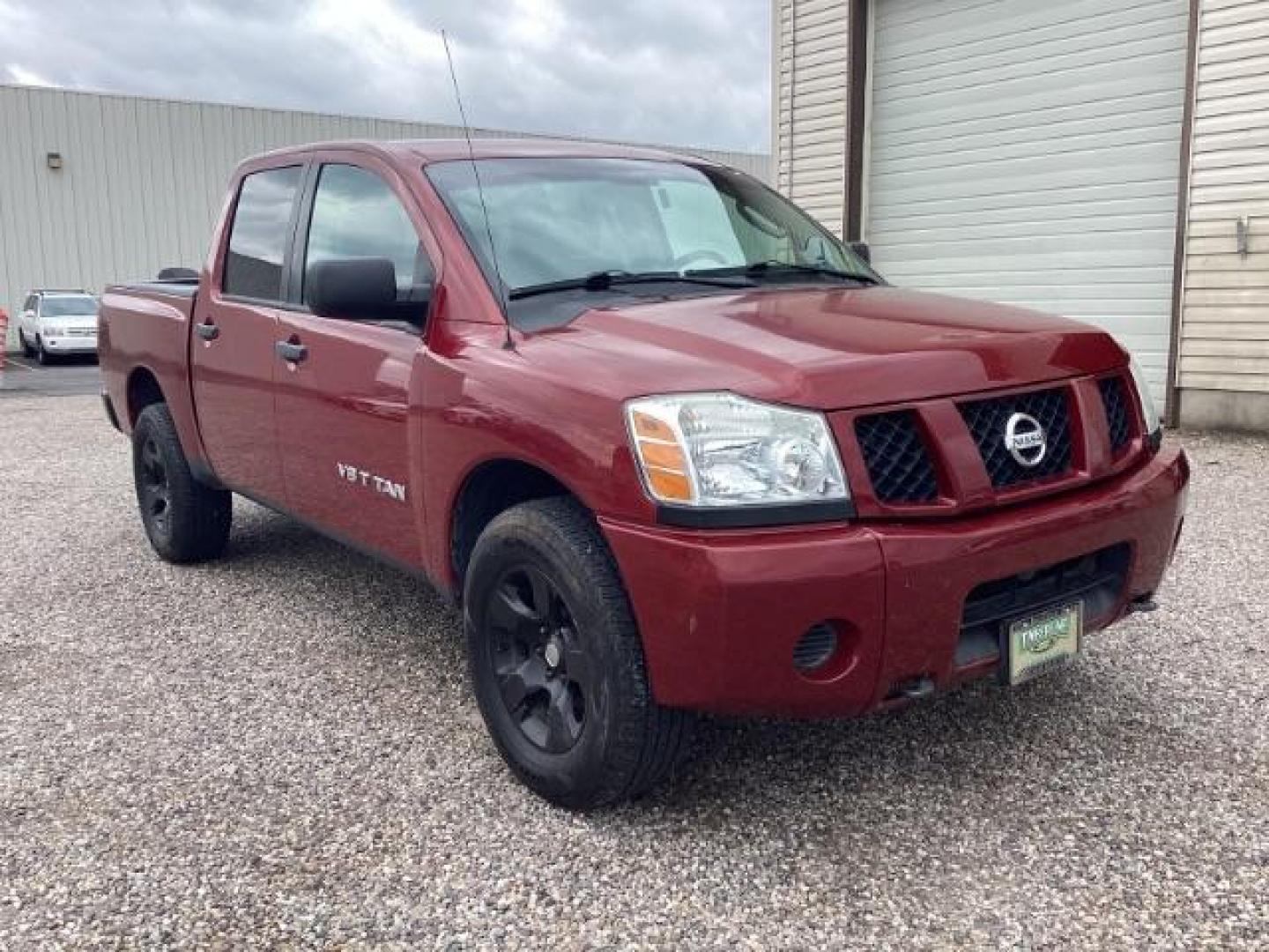 2006 Red Brawn /Graphite/Titanium Cloth Interior Nissan Titan XE Crew Cab 4WD (1N6AA07B46N) with an 5.6L V8 DOHC 32V engine, 5-Speed Automatic transmission, located at 1235 N Woodruff Ave., Idaho Falls, 83401, (208) 523-1053, 43.507172, -112.000488 - Photo#0