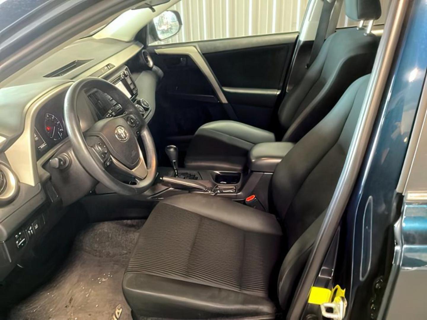 2018 Galactic Aqua Mica /Black, cloth Toyota RAV4 (2T3ZFREV9JW) with an 25L L4 DOHC 16V engine, Automatic transmission, located at 1175 N Woodruff Ave, Idaho Falls, ID, 83401, 43.506901, -111.999657 - At Timberline Auto, finding a great deal on your next vehicle is always easy! Our experienced sales staff's goal is to help find you the right vehicle at the right price! Our knowledgeable finance department has options for almost any credit score. We offer extended service contract options to prote - Photo#7