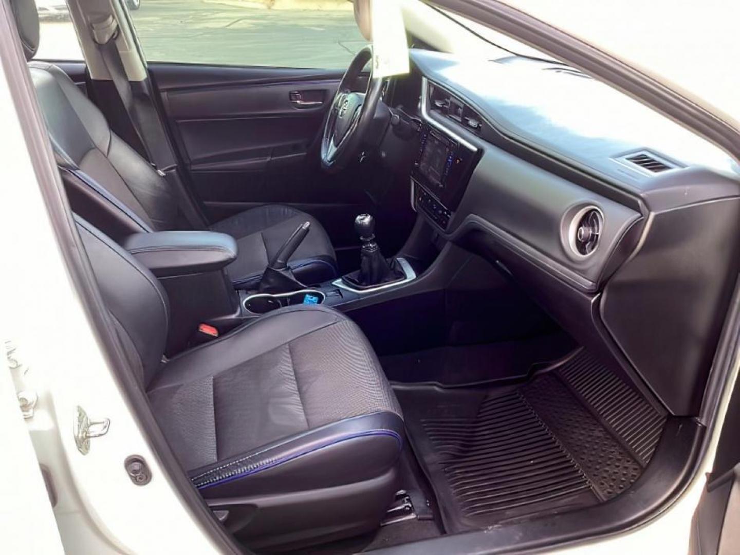 2019 Super White /Black Mixed Media, leatherette/cloth Toyota Corolla SE 6M (2T1BURHE4KC) with an 1.8L L4 DOHC 16V engine, 6-Speed Manual transmission, located at 1235 N Woodruff Ave., Idaho Falls, 83401, (208) 523-1053, 43.507172, -112.000488 - At Timberline Auto, finding a great deal on your next vehicle is always easy! Our experienced sales staff's goal is to help find you the right vehicle at the right price! Our knowledgeable finance department has options for almost any credit score. We offer extended service contract options to prote - Photo#12