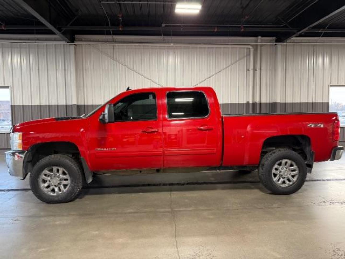 2013 Victory Red /Ebony Leather Interior Chevrolet Silverado 3500HD LTZ Crew Cab 4WD (1GC4K1E80DF) with an 6.6L V8 OHV 32V TURBO DIESEL engine, 6-Speed Automatic transmission, located at 1235 N Woodruff Ave., Idaho Falls, 83401, (208) 523-1053, 43.507172, -112.000488 - At Timberline Auto, finding a great deal on your next vehicle is always easy! Our experienced sales staff's goal is to help find you the right vehicle at the right price! Our knowledgeable finance department has options for almost any credit score. We offer extended service contract options to prote - Photo#1