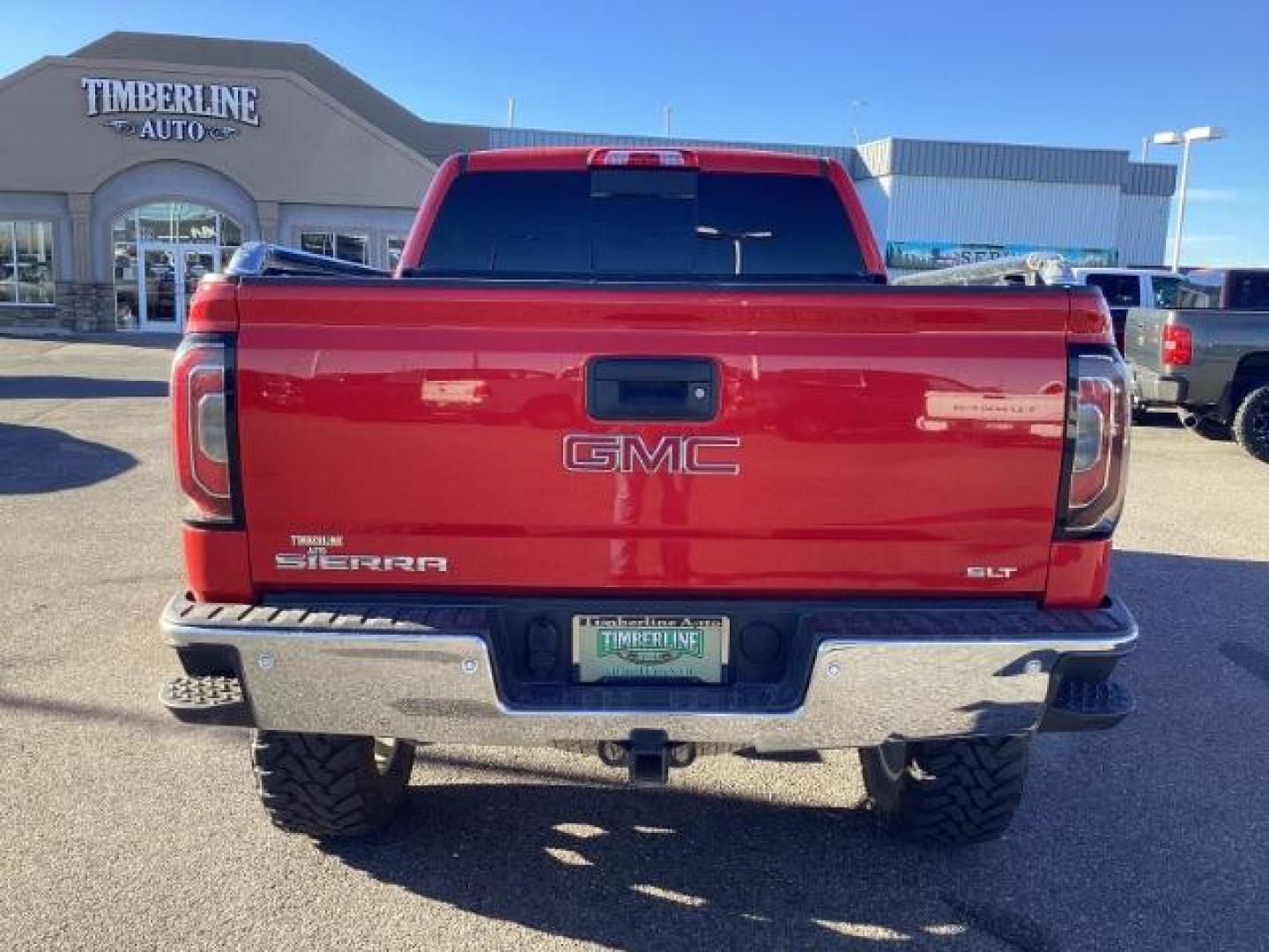 2017 Cardinal Red /Jet Black, leather GMC Sierra 1500 SLT Crew Cab Short Box 4WD (3GTU2NEC1HG) with an 5.3L V8 OHV 16V engine, 6-Speed Automatic transmission, located at 1235 N Woodruff Ave., Idaho Falls, 83401, (208) 523-1053, 43.507172, -112.000488 - At Timberline Auto, finding a great deal on your next vehicle is always easy! Our experienced sales staff's goal is to help find you the right vehicle at the right price! Our knowledgeable finance department has options for almost any credit score. We offer extended service contract options to prote - Photo#4