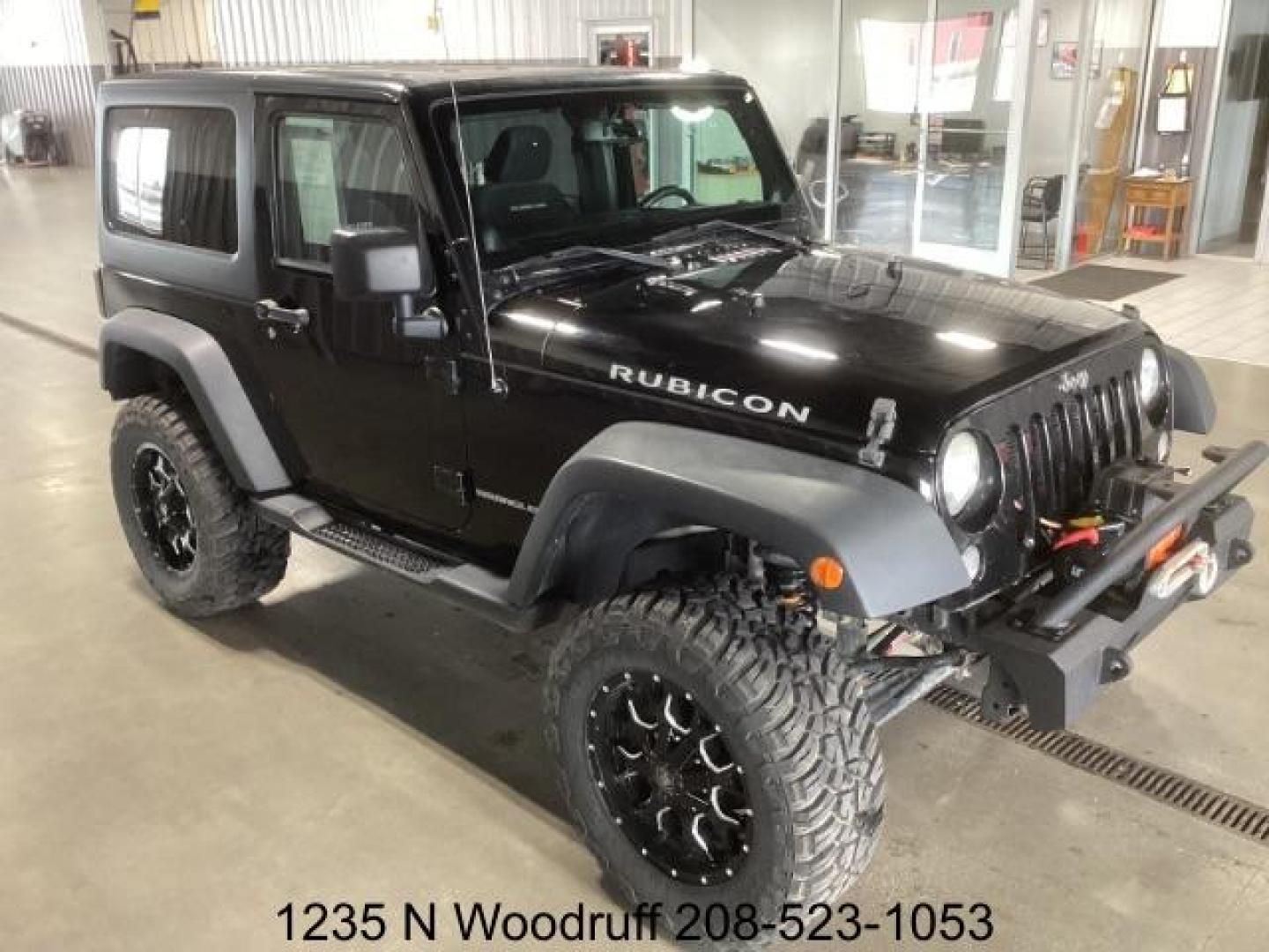 2014 Black Clearcoat /Black Jeep Wrangler Rubicon 4WD (1C4BJWCG6EL) with an 3.6L V6 DOHC 24V FFV engine, 5-Speed Automatic transmission, located at 1235 N Woodruff Ave., Idaho Falls, 83401, (208) 523-1053, 43.507172, -112.000488 - Photo#7