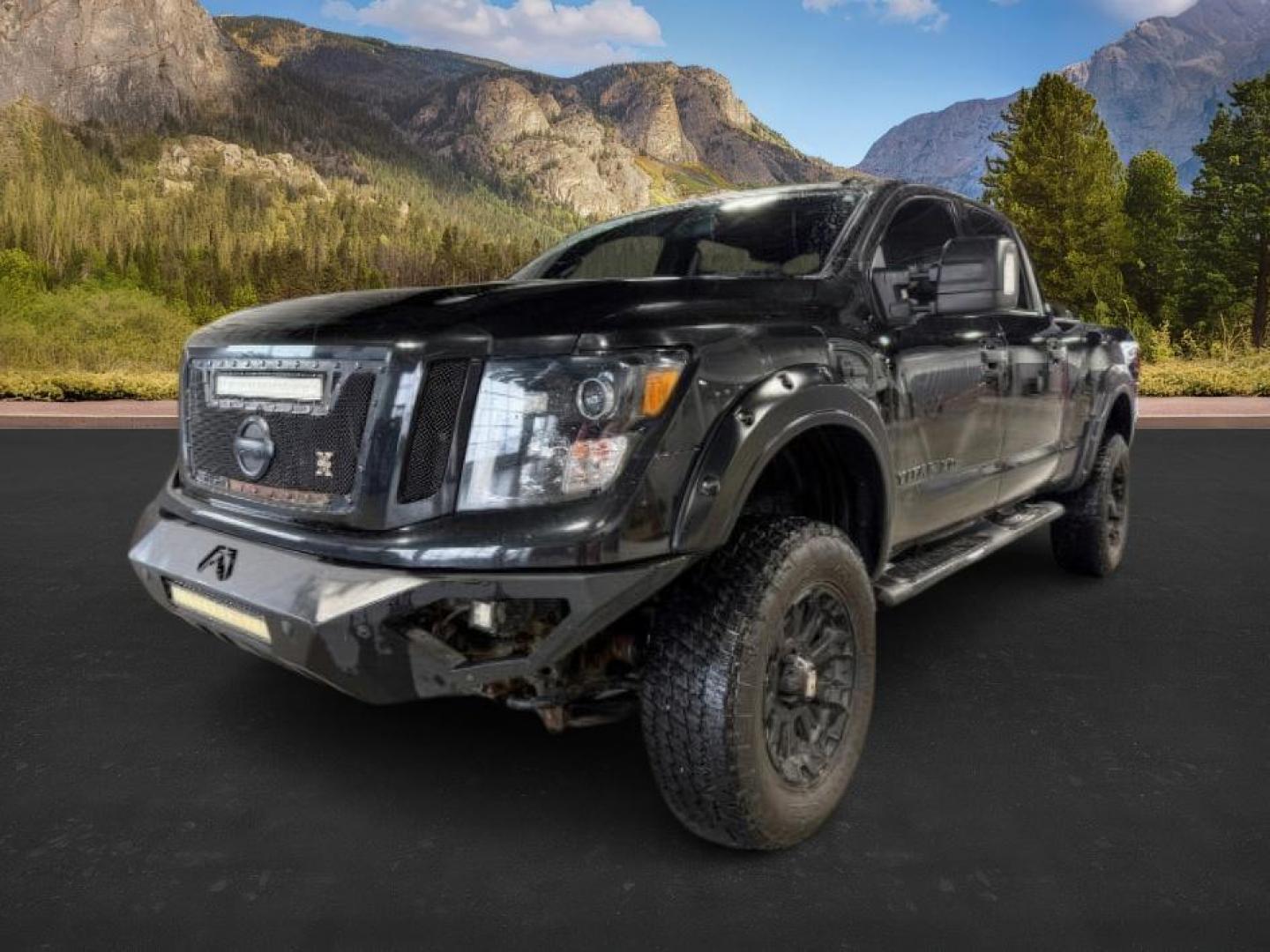2018 BLACK /Black, leather Nissan Titan XD SL Midnight Edition 4x4 (1N6BA1F4XJN) with an 5.0L V8 DOHC 32V DIESEL engine, 6-Speed Automatic transmission, located at 1235 N Woodruff Ave., Idaho Falls, 83401, (208) 523-1053, 43.507172, -112.000488 - At Timberline Auto, finding a great deal on your next vehicle is always easy! Our experienced sales staff's goal is to help find you the right vehicle at the right price! Our knowledgeable finance department has options for almost any credit score. We offer extended service contract options to prote - Photo#0
