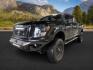 2018 BLACK /Black, leather Nissan Titan XD SL Midnight Edition 4x4 (1N6BA1F4XJN) with an 5.0L V8 DOHC 32V DIESEL engine, 6-Speed Automatic transmission, located at 1235 N Woodruff Ave., Idaho Falls, 83401, (208) 523-1053, 43.507172, -112.000488 - At Timberline Auto, finding a great deal on your next vehicle is always easy! Our experienced sales staff's goal is to help find you the right vehicle at the right price! Our knowledgeable finance department has options for almost any credit score. We offer extended service contract options to prote - Photo#0