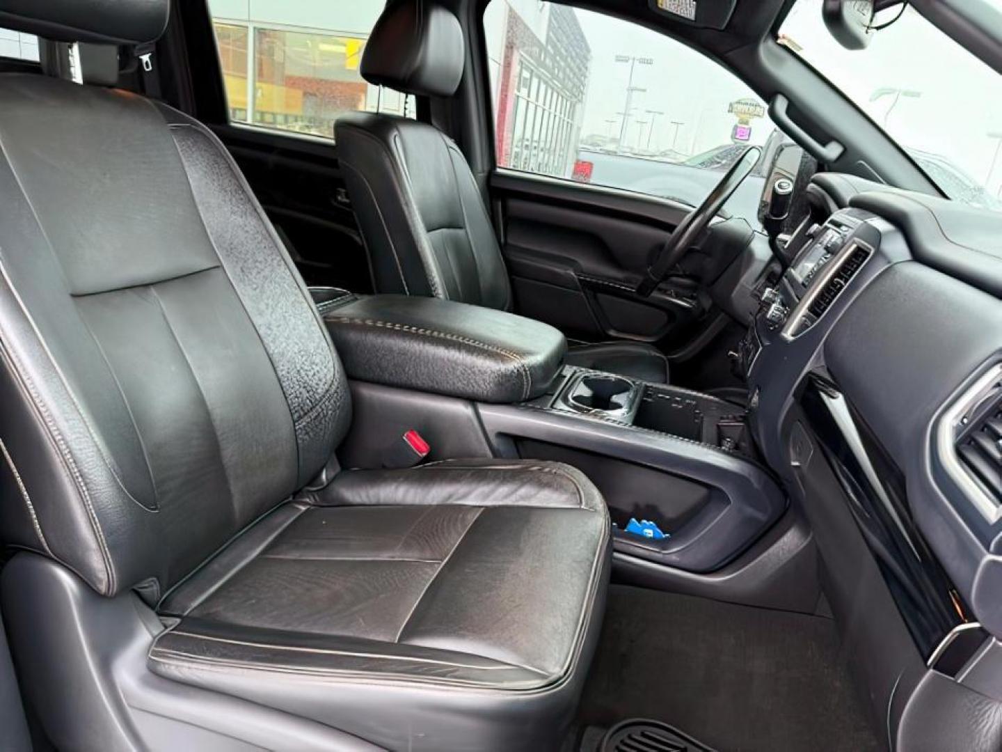 2018 BLACK /Black, leather Nissan Titan XD SL Midnight Edition 4x4 (1N6BA1F4XJN) with an 5.0L V8 DOHC 32V DIESEL engine, 6-Speed Automatic transmission, located at 1235 N Woodruff Ave., Idaho Falls, 83401, (208) 523-1053, 43.507172, -112.000488 - At Timberline Auto, finding a great deal on your next vehicle is always easy! Our experienced sales staff's goal is to help find you the right vehicle at the right price! Our knowledgeable finance department has options for almost any credit score. We offer extended service contract options to prote - Photo#12