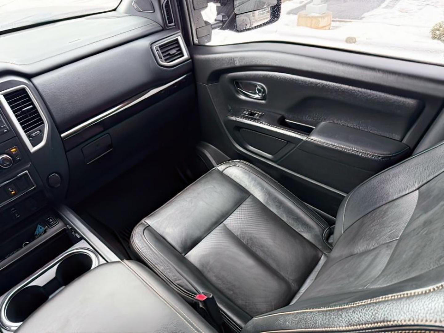 2018 BLACK /Black, leather Nissan Titan XD SL Midnight Edition 4x4 (1N6BA1F4XJN) with an 5.0L V8 DOHC 32V DIESEL engine, 6-Speed Automatic transmission, located at 1235 N Woodruff Ave., Idaho Falls, 83401, (208) 523-1053, 43.507172, -112.000488 - At Timberline Auto, finding a great deal on your next vehicle is always easy! Our experienced sales staff's goal is to help find you the right vehicle at the right price! Our knowledgeable finance department has options for almost any credit score. We offer extended service contract options to prote - Photo#15
