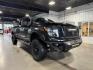 2018 BLACK /Black, leather Nissan Titan XD SL Midnight Edition 4x4 (1N6BA1F4XJN) with an 5.0L V8 DOHC 32V DIESEL engine, 6-Speed Automatic transmission, located at 1235 N Woodruff Ave., Idaho Falls, 83401, (208) 523-1053, 43.507172, -112.000488 - At Timberline Auto, finding a great deal on your next vehicle is always easy! Our experienced sales staff's goal is to help find you the right vehicle at the right price! Our knowledgeable finance department has options for almost any credit score. We offer extended service contract options to prote - Photo#4