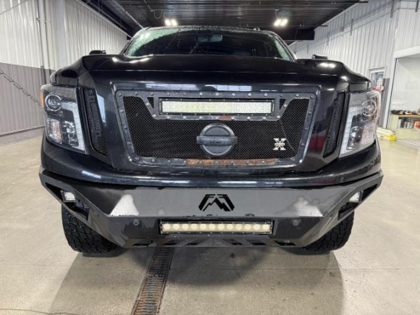 2018 BLACK /Black, leather Nissan Titan XD SL Midnight Edition 4x4 (1N6BA1F4XJN) with an 5.0L V8 DOHC 32V DIESEL engine, 6-Speed Automatic transmission, located at 1235 N Woodruff Ave., Idaho Falls, 83401, (208) 523-1053, 43.507172, -112.000488 - At Timberline Auto, finding a great deal on your next vehicle is always easy! Our experienced sales staff's goal is to help find you the right vehicle at the right price! Our knowledgeable finance department has options for almost any credit score. We offer extended service contract options to prote - Photo#5