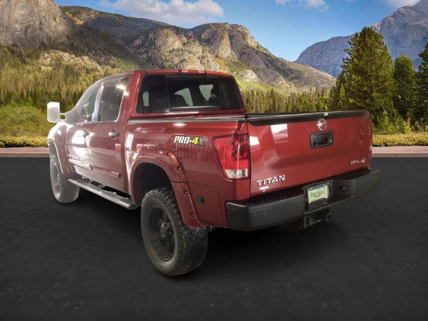 2014 Venetian Ruby /Charcoal II Nissan Titan PRO-4X Crew Cab 4WD SWB (1N6AA0ECXEN) with an 5.6L V8 DOHC 32V engine, 5-Speed Automatic transmission, located at 1235 N Woodruff Ave., Idaho Falls, 83401, (208) 523-1053, 43.507172, -112.000488 - At Timberline Auto, finding a great deal on your next vehicle is always easy! Our experienced sales staff's goal is to help find you the right vehicle at the right price! Our knowledgeable finance department has options for almost any credit score. We offer extended service contract options to prote - Photo#2