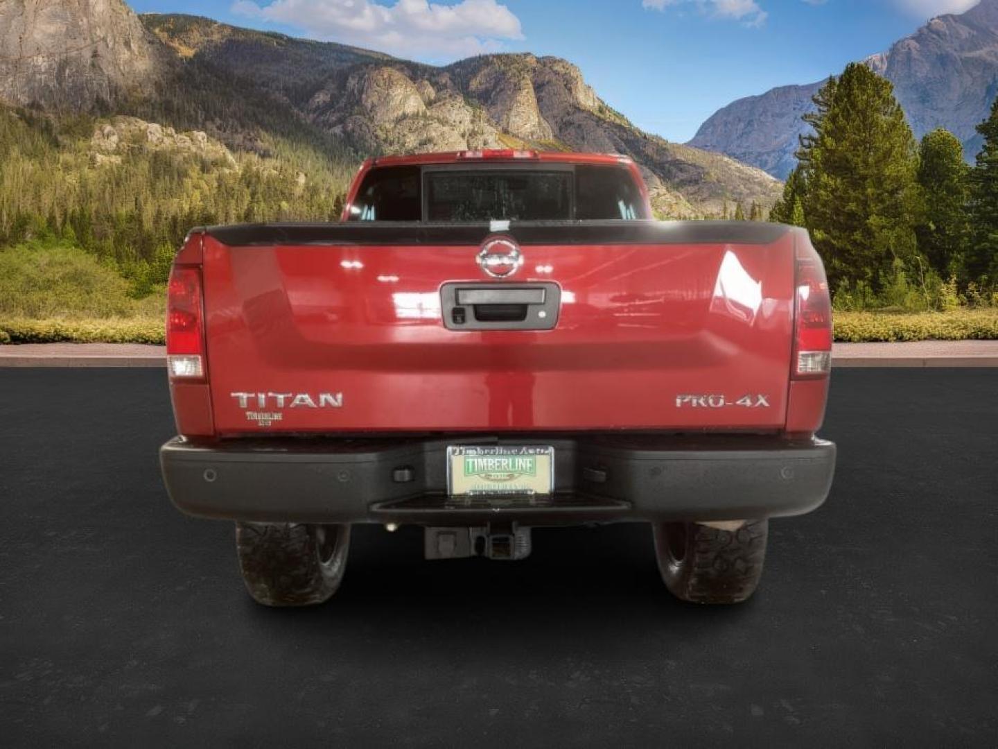 2014 Venetian Ruby /Charcoal II Nissan Titan PRO-4X Crew Cab 4WD SWB (1N6AA0ECXEN) with an 5.6L V8 DOHC 32V engine, 5-Speed Automatic transmission, located at 1235 N Woodruff Ave., Idaho Falls, 83401, (208) 523-1053, 43.507172, -112.000488 - At Timberline Auto, finding a great deal on your next vehicle is always easy! Our experienced sales staff's goal is to help find you the right vehicle at the right price! Our knowledgeable finance department has options for almost any credit score. We offer extended service contract options to prote - Photo#3