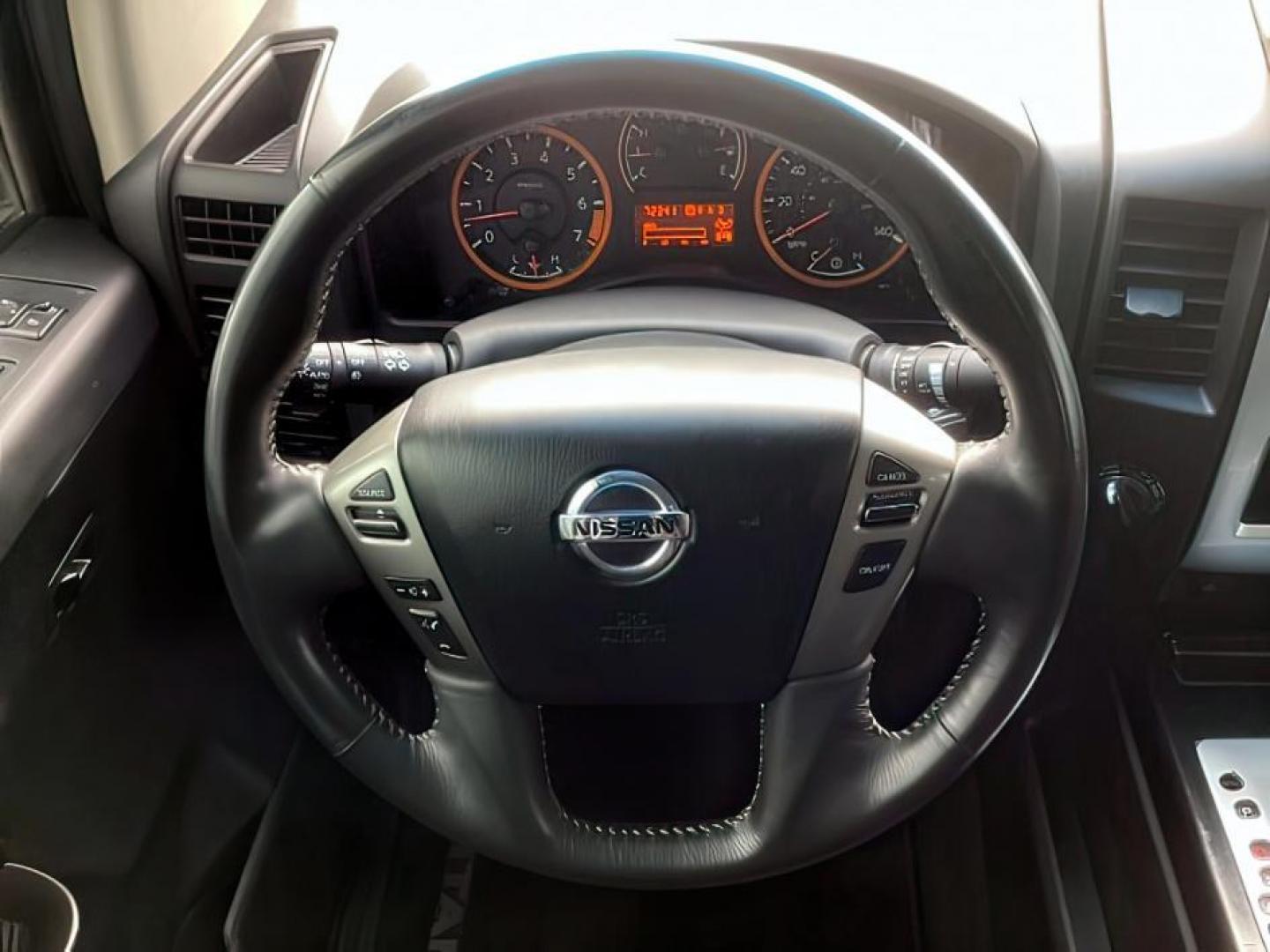2014 Venetian Ruby /Charcoal II Nissan Titan PRO-4X Crew Cab 4WD SWB (1N6AA0ECXEN) with an 5.6L V8 DOHC 32V engine, 5-Speed Automatic transmission, located at 1235 N Woodruff Ave., Idaho Falls, 83401, (208) 523-1053, 43.507172, -112.000488 - At Timberline Auto, finding a great deal on your next vehicle is always easy! Our experienced sales staff's goal is to help find you the right vehicle at the right price! Our knowledgeable finance department has options for almost any credit score. We offer extended service contract options to prote - Photo#23