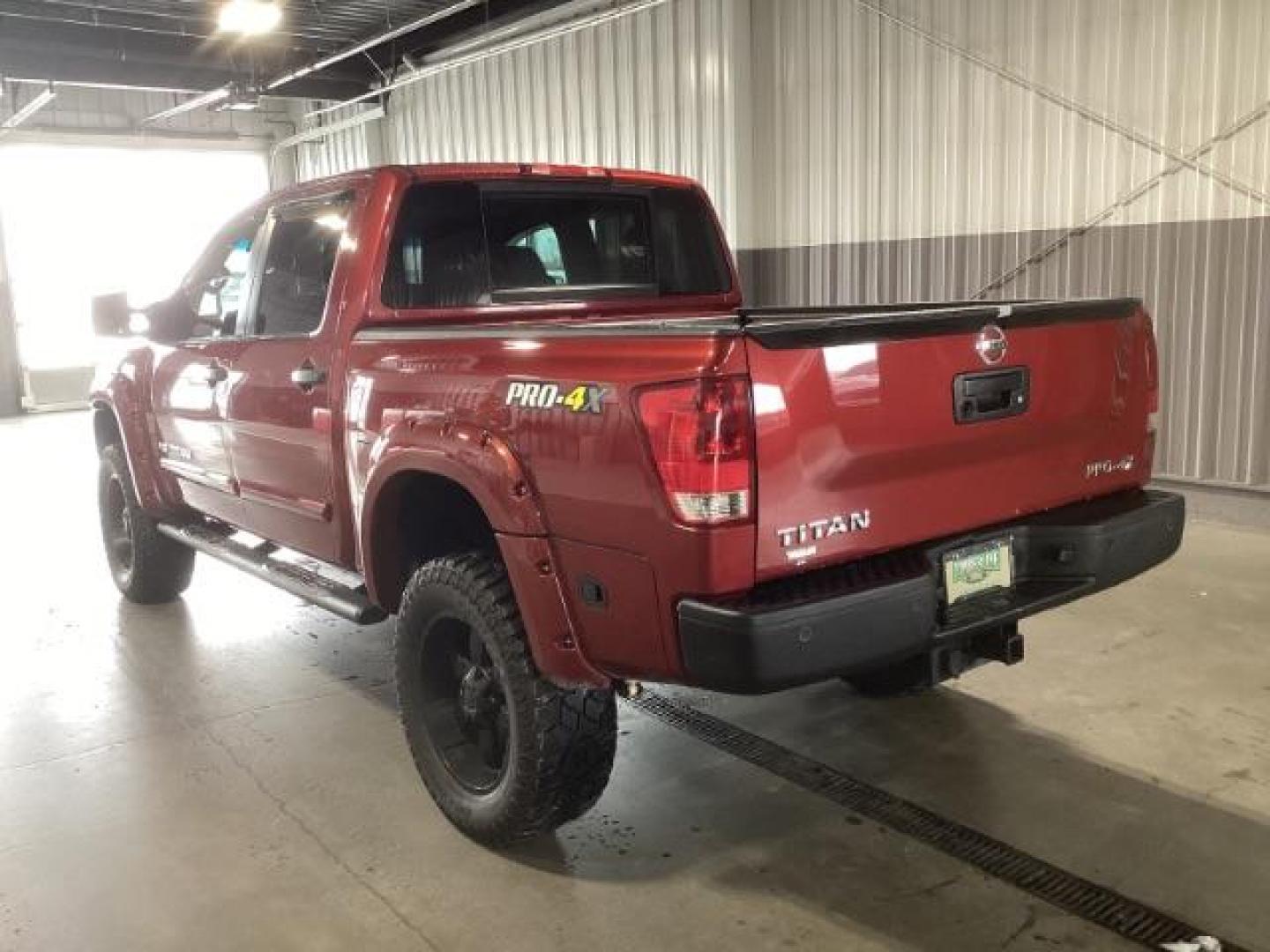 2014 Venetian Ruby /Charcoal II Nissan Titan PRO-4X Crew Cab 4WD SWB (1N6AA0ECXEN) with an 5.6L V8 DOHC 32V engine, 5-Speed Automatic transmission, located at 1235 N Woodruff Ave., Idaho Falls, 83401, (208) 523-1053, 43.507172, -112.000488 - At Timberline Auto, finding a great deal on your next vehicle is always easy! Our experienced sales staff's goal is to help find you the right vehicle at the right price! Our knowledgeable finance department has options for almost any credit score. We offer extended service contract options to prote - Photo#2