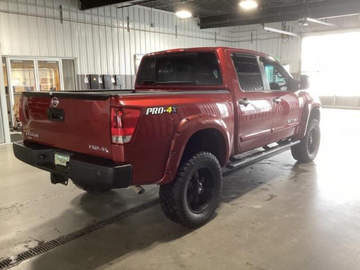 2014 Venetian Ruby /Charcoal II Nissan Titan PRO-4X Crew Cab 4WD SWB (1N6AA0ECXEN) with an 5.6L V8 DOHC 32V engine, 5-Speed Automatic transmission, located at 1235 N Woodruff Ave., Idaho Falls, 83401, (208) 523-1053, 43.507172, -112.000488 - At Timberline Auto, finding a great deal on your next vehicle is always easy! Our experienced sales staff's goal is to help find you the right vehicle at the right price! Our knowledgeable finance department has options for almost any credit score. We offer extended service contract options to prote - Photo#4