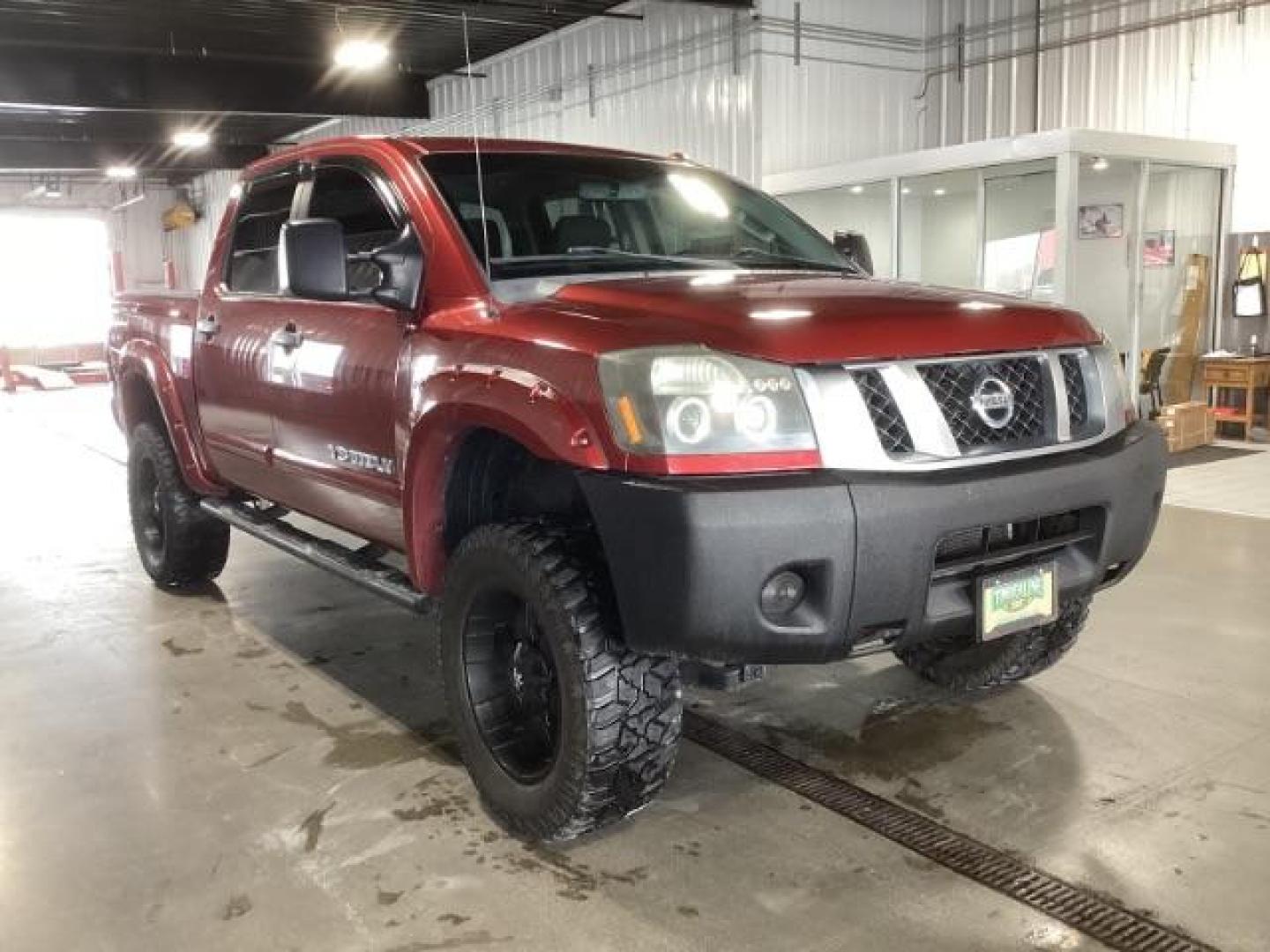 2014 Venetian Ruby /Charcoal II Nissan Titan PRO-4X Crew Cab 4WD SWB (1N6AA0ECXEN) with an 5.6L V8 DOHC 32V engine, 5-Speed Automatic transmission, located at 1235 N Woodruff Ave., Idaho Falls, 83401, (208) 523-1053, 43.507172, -112.000488 - At Timberline Auto, finding a great deal on your next vehicle is always easy! Our experienced sales staff's goal is to help find you the right vehicle at the right price! Our knowledgeable finance department has options for almost any credit score. We offer extended service contract options to prote - Photo#5