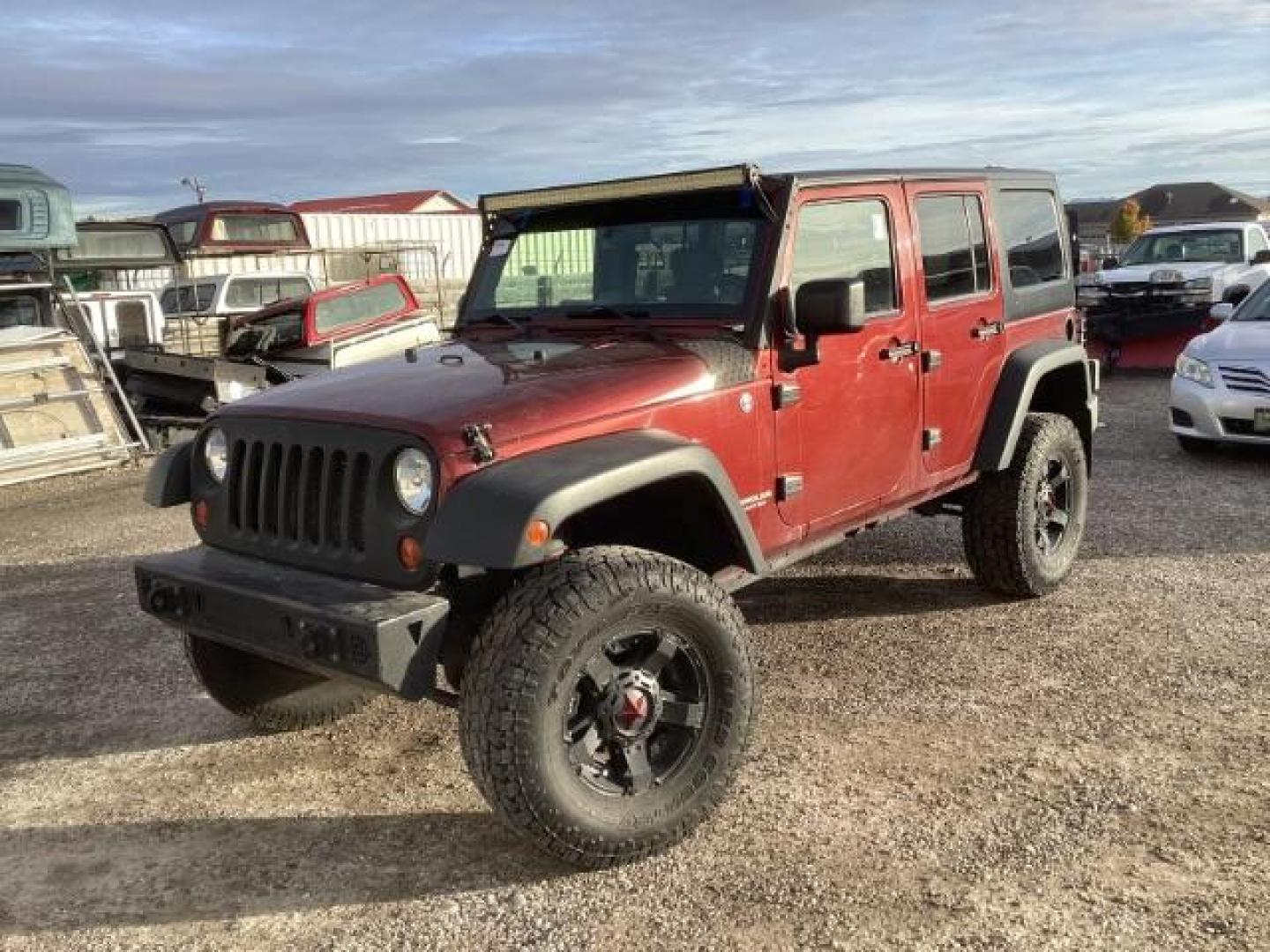 2008 Flame Red with Black Hard Top Jeep Wrangler Unlimited X 4WD (1J4GA39128L) with an 3.8L V6 OHV 12V engine, 6-Speed Manual transmission, located at 1235 N Woodruff Ave., Idaho Falls, 83401, (208) 523-1053, 43.507172, -112.000488 - Photo#0