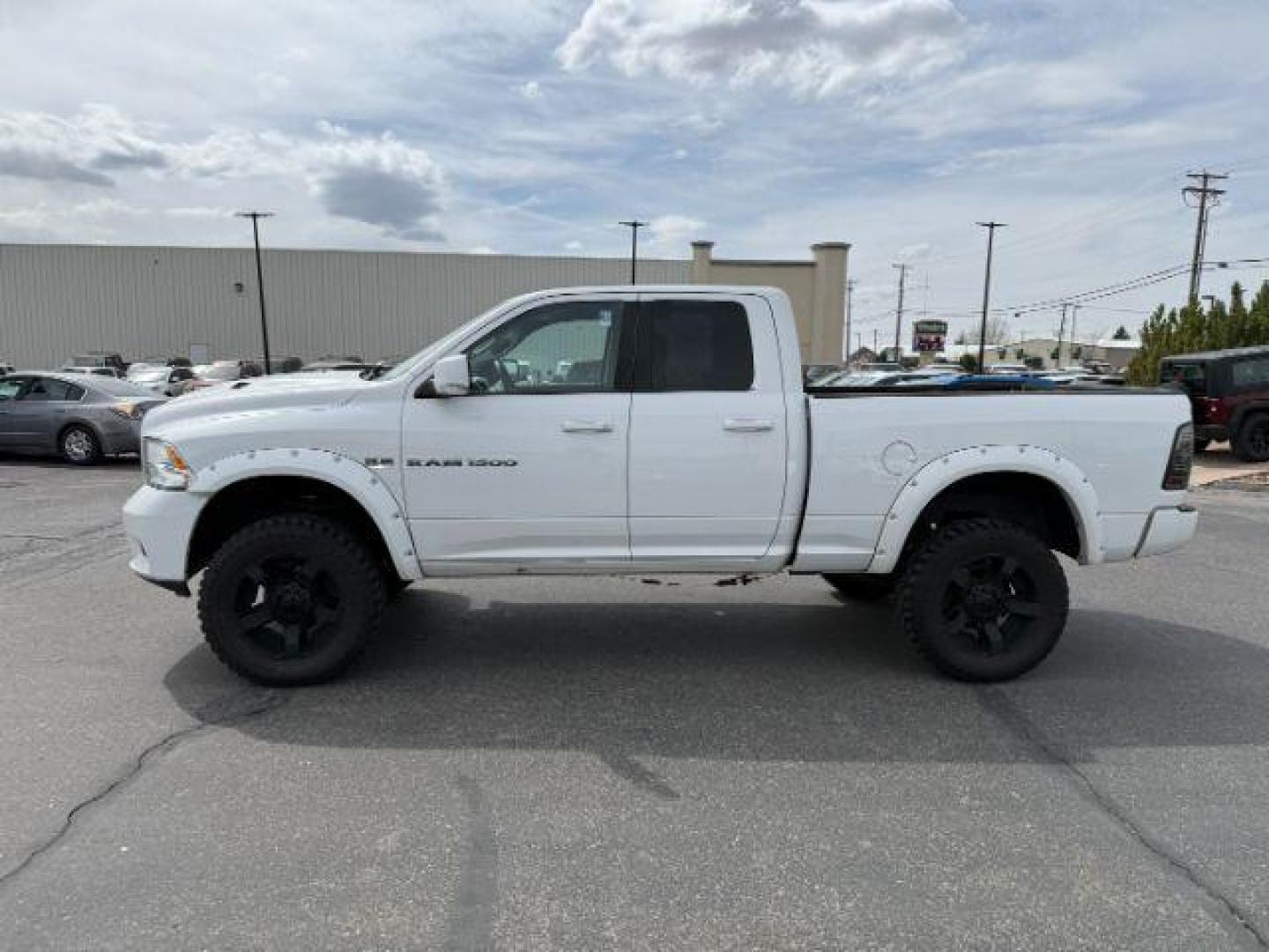 2011 Bright White /Dark Slate Leather Interior RAM 1500 Laramie Quad Cab 4WD (1D7RV1GT9BS) with an 5.7L V8 OHV 16V engine, 5-Speed Automatic transmission, located at 1235 N Woodruff Ave., Idaho Falls, 83401, (208) 523-1053, 43.507172, -112.000488 - At Timberline Auto, finding a great deal on your next vehicle is always easy! Our experienced sales staff's goal is to help find you the right vehicle at the right price! Our knowledgeable finance department has options for almost any credit score. We offer extended service contract options to prote - Photo#1