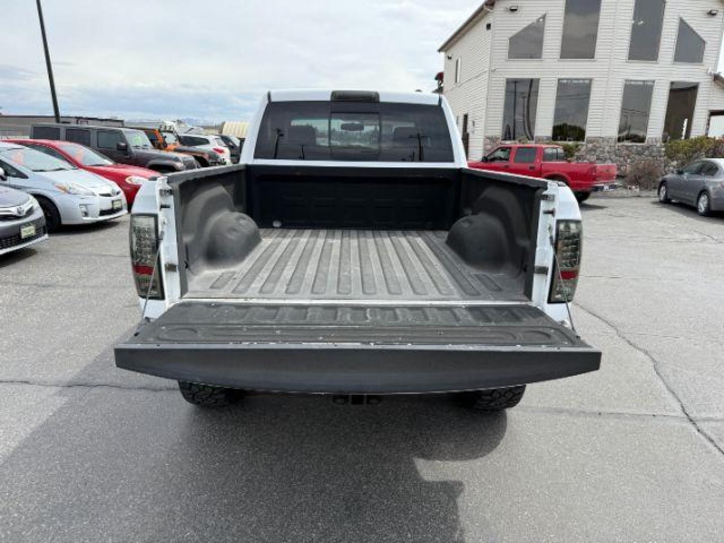 2011 Bright White /Dark Slate Leather Interior RAM 1500 Laramie Quad Cab 4WD (1D7RV1GT9BS) with an 5.7L V8 OHV 16V engine, 5-Speed Automatic transmission, located at 1235 N Woodruff Ave., Idaho Falls, 83401, (208) 523-1053, 43.507172, -112.000488 - At Timberline Auto, finding a great deal on your next vehicle is always easy! Our experienced sales staff's goal is to help find you the right vehicle at the right price! Our knowledgeable finance department has options for almost any credit score. We offer extended service contract options to prote - Photo#5