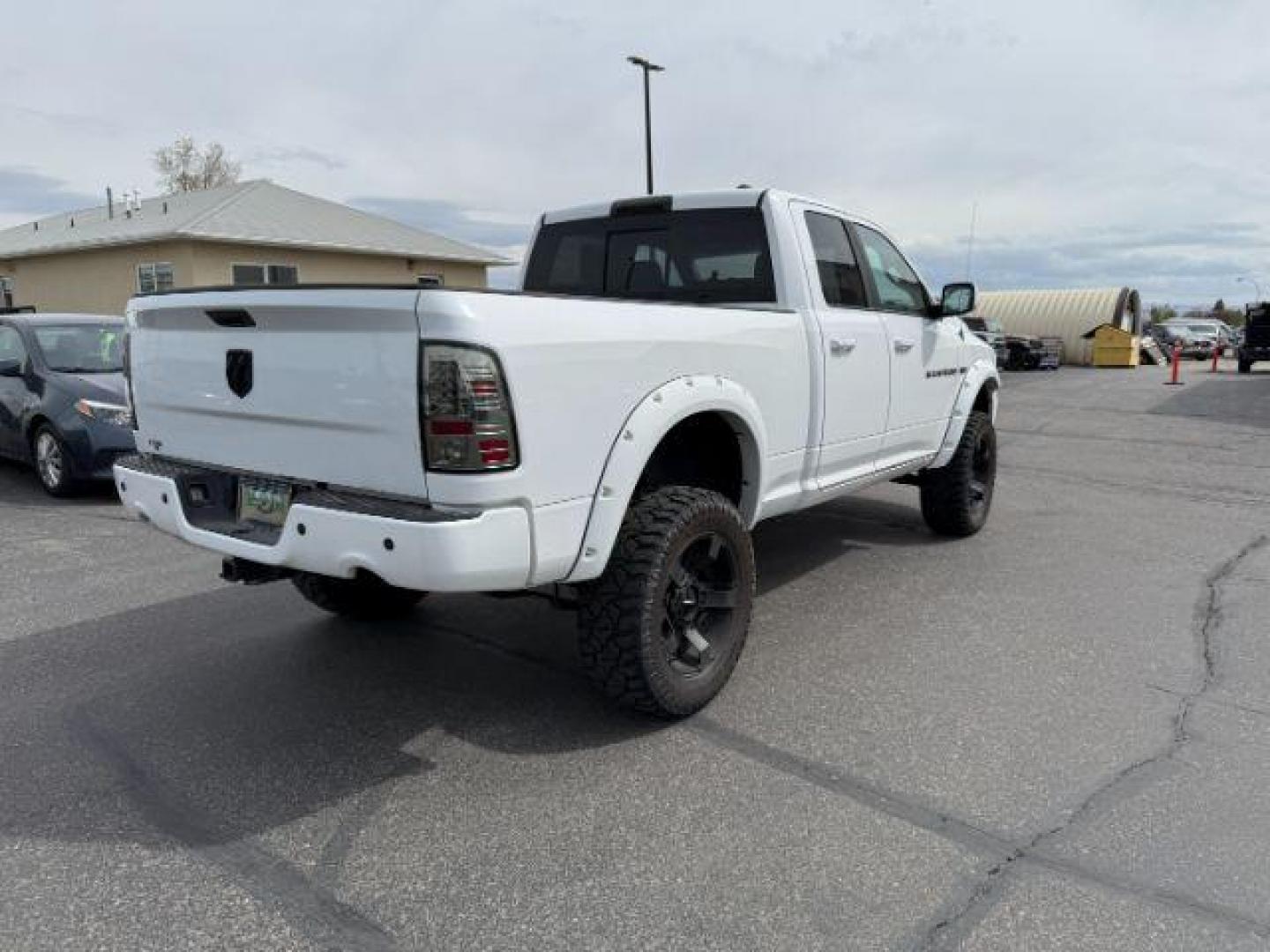 2011 Bright White /Dark Slate Leather Interior RAM 1500 Laramie Quad Cab 4WD (1D7RV1GT9BS) with an 5.7L V8 OHV 16V engine, 5-Speed Automatic transmission, located at 1235 N Woodruff Ave., Idaho Falls, 83401, (208) 523-1053, 43.507172, -112.000488 - At Timberline Auto, finding a great deal on your next vehicle is always easy! Our experienced sales staff's goal is to help find you the right vehicle at the right price! Our knowledgeable finance department has options for almost any credit score. We offer extended service contract options to prote - Photo#6