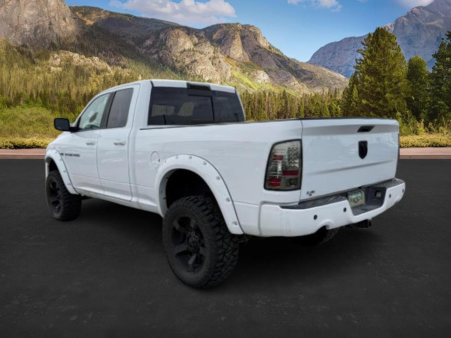2011 Bright White /Dark Slate Leather Interior RAM 1500 Laramie Quad Cab 4WD (1D7RV1GT9BS) with an 5.7L V8 OHV 16V engine, 5-Speed Automatic transmission, located at 1235 N Woodruff Ave., Idaho Falls, 83401, (208) 523-1053, 43.507172, -112.000488 - At Timberline Auto, finding a great deal on your next vehicle is always easy! Our experienced sales staff's goal is to help find you the right vehicle at the right price! Our knowledgeable finance department has options for almost any credit score. We offer extended service contract options to prote - Photo#2