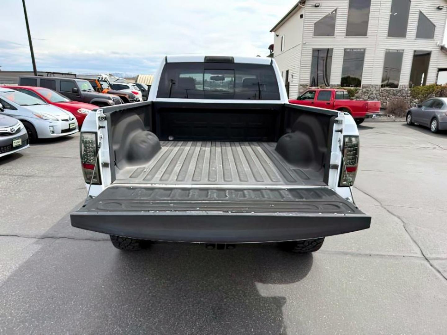 2011 Bright White /Dark Slate Leather Interior RAM 1500 Laramie Quad Cab 4WD (1D7RV1GT9BS) with an 5.7L V8 OHV 16V engine, 5-Speed Automatic transmission, located at 1235 N Woodruff Ave., Idaho Falls, 83401, (208) 523-1053, 43.507172, -112.000488 - At Timberline Auto, finding a great deal on your next vehicle is always easy! Our experienced sales staff's goal is to help find you the right vehicle at the right price! Our knowledgeable finance department has options for almost any credit score. We offer extended service contract options to prote - Photo#5
