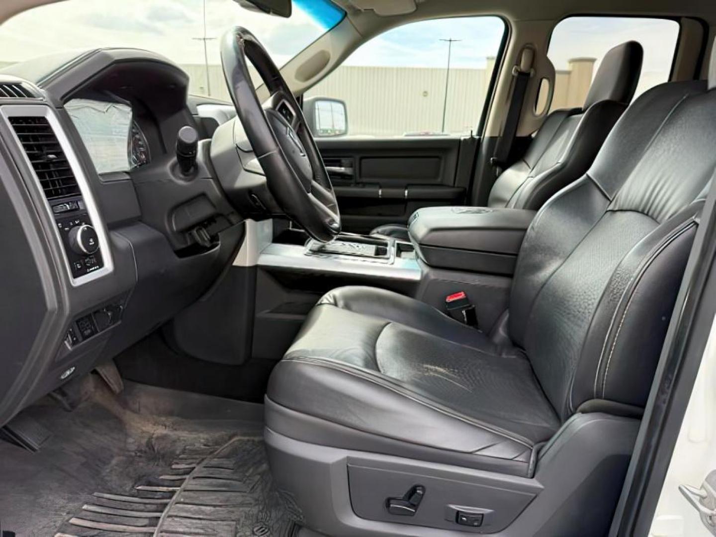 2011 Bright White /Dark Slate Leather Interior RAM 1500 Laramie Quad Cab 4WD (1D7RV1GT9BS) with an 5.7L V8 OHV 16V engine, 5-Speed Automatic transmission, located at 1235 N Woodruff Ave., Idaho Falls, 83401, (208) 523-1053, 43.507172, -112.000488 - At Timberline Auto, finding a great deal on your next vehicle is always easy! Our experienced sales staff's goal is to help find you the right vehicle at the right price! Our knowledgeable finance department has options for almost any credit score. We offer extended service contract options to prote - Photo#11