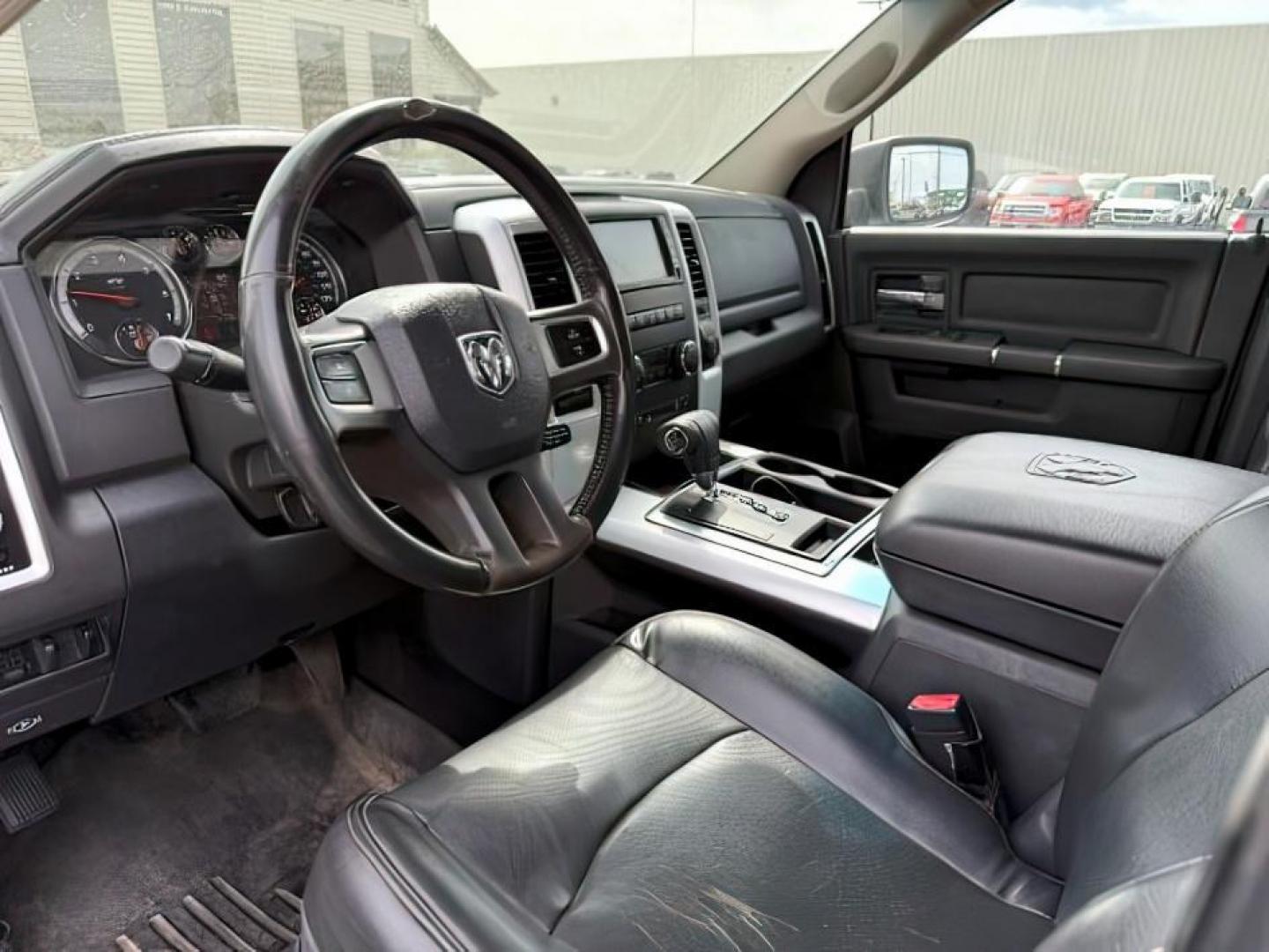 2011 Bright White /Dark Slate Leather Interior RAM 1500 Laramie Quad Cab 4WD (1D7RV1GT9BS) with an 5.7L V8 OHV 16V engine, 5-Speed Automatic transmission, located at 1235 N Woodruff Ave., Idaho Falls, 83401, (208) 523-1053, 43.507172, -112.000488 - At Timberline Auto, finding a great deal on your next vehicle is always easy! Our experienced sales staff's goal is to help find you the right vehicle at the right price! Our knowledgeable finance department has options for almost any credit score. We offer extended service contract options to prote - Photo#12