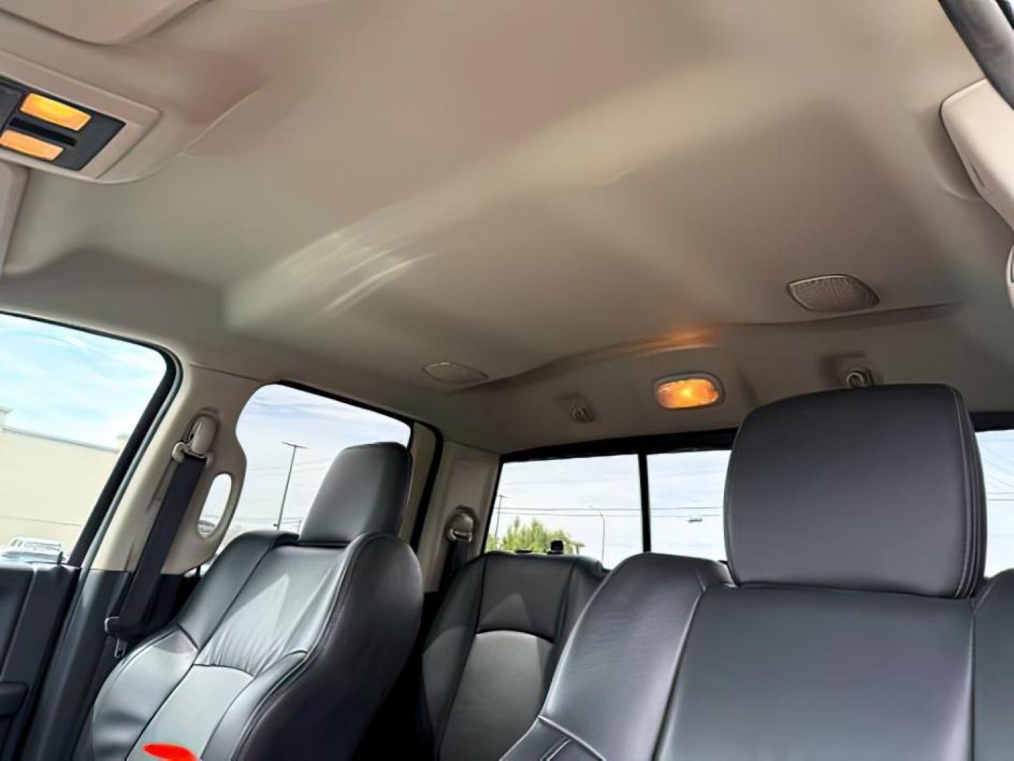 2011 Bright White /Dark Slate Leather Interior RAM 1500 Laramie Quad Cab 4WD (1D7RV1GT9BS) with an 5.7L V8 OHV 16V engine, 5-Speed Automatic transmission, located at 1235 N Woodruff Ave., Idaho Falls, 83401, (208) 523-1053, 43.507172, -112.000488 - At Timberline Auto, finding a great deal on your next vehicle is always easy! Our experienced sales staff's goal is to help find you the right vehicle at the right price! Our knowledgeable finance department has options for almost any credit score. We offer extended service contract options to prote - Photo#17