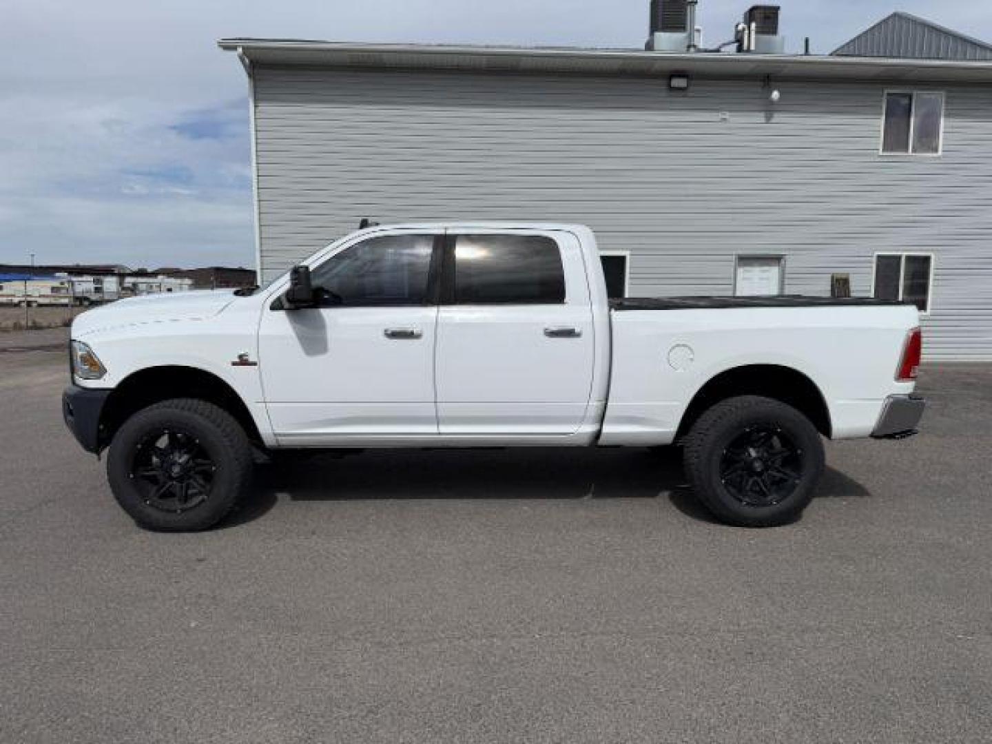 2013 Bright White Clearcoat /Black Ram 3500 (3C63R3EL8DG) with an 67L L6 OHV 24V TURBO DIESEL engine, Automatic transmission, located at 1175 N Woodruff Ave, Idaho Falls, ID, 83401, 43.506901, -111.999657 - At Timberline Auto, finding a great deal on your next vehicle is always easy! Our experienced sales staff's goal is to help find you the right vehicle at the right price! Our knowledgeable finance department has options for almost any credit score. We offer extended service contract options to prote - Photo#25