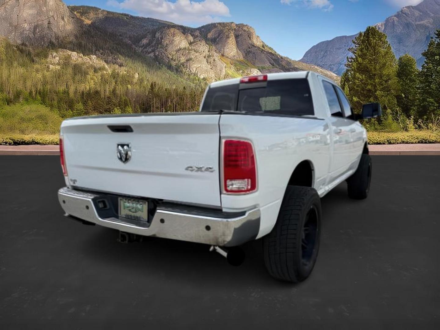 2013 Bright White Clearcoat /Black Ram 3500 (3C63R3EL8DG) with an 67L L6 OHV 24V TURBO DIESEL engine, Automatic transmission, located at 1175 N Woodruff Ave, Idaho Falls, ID, 83401, 43.506901, -111.999657 - At Timberline Auto, finding a great deal on your next vehicle is always easy! Our experienced sales staff's goal is to help find you the right vehicle at the right price! Our knowledgeable finance department has options for almost any credit score. We offer extended service contract options to prote - Photo#6