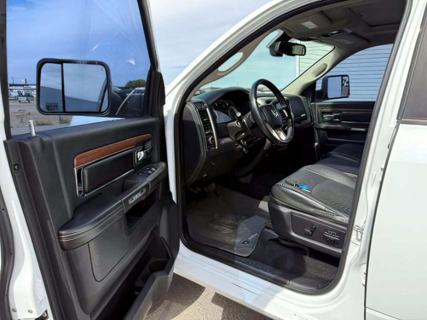 2013 Bright White Clearcoat /Black Ram 3500 (3C63R3EL8DG) with an 67L L6 OHV 24V TURBO DIESEL engine, Automatic transmission, located at 1175 N Woodruff Ave, Idaho Falls, ID, 83401, 43.506901, -111.999657 - At Timberline Auto, finding a great deal on your next vehicle is always easy! Our experienced sales staff's goal is to help find you the right vehicle at the right price! Our knowledgeable finance department has options for almost any credit score. We offer extended service contract options to prote - Photo#11