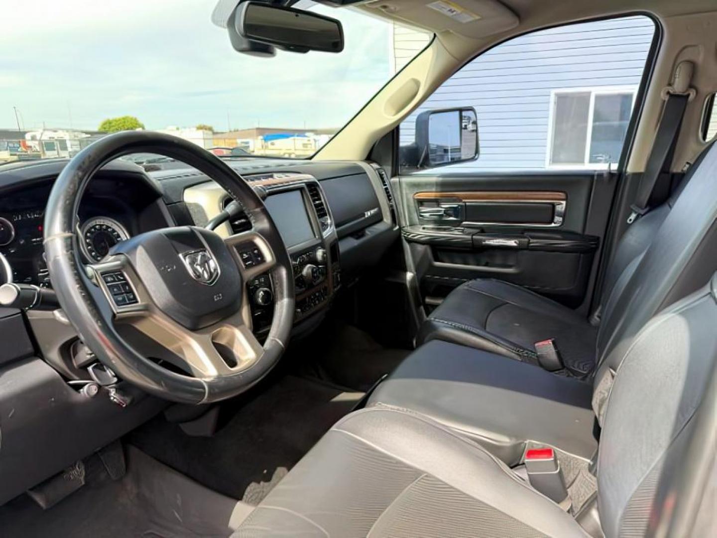 2013 Bright White Clearcoat /Black Ram 3500 (3C63R3EL8DG) with an 67L L6 OHV 24V TURBO DIESEL engine, Automatic transmission, located at 1175 N Woodruff Ave, Idaho Falls, ID, 83401, 43.506901, -111.999657 - At Timberline Auto, finding a great deal on your next vehicle is always easy! Our experienced sales staff's goal is to help find you the right vehicle at the right price! Our knowledgeable finance department has options for almost any credit score. We offer extended service contract options to prote - Photo#13