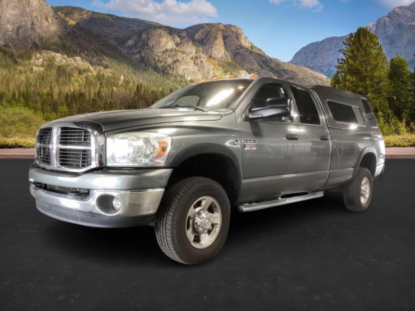 2007 GRAY /Medium Slate Gray Cloth Interior Dodge Ram 3500 SLT Quad Cab LWB 4WD DRW (3D7MX38C57G) with an 5.9L L6 OHV 24V TURBO DIESEL engine, 4-Speed Automatic transmission, located at 1235 N Woodruff Ave., Idaho Falls, 83401, (208) 523-1053, 43.507172, -112.000488 - At Timberline Auto, finding a great deal on your next vehicle is always easy! Our experienced sales staff's goal is to help find you the right vehicle at the right price! Our knowledgeable finance department has options for almost any credit score. We offer extended service contract options to prote - Photo#0