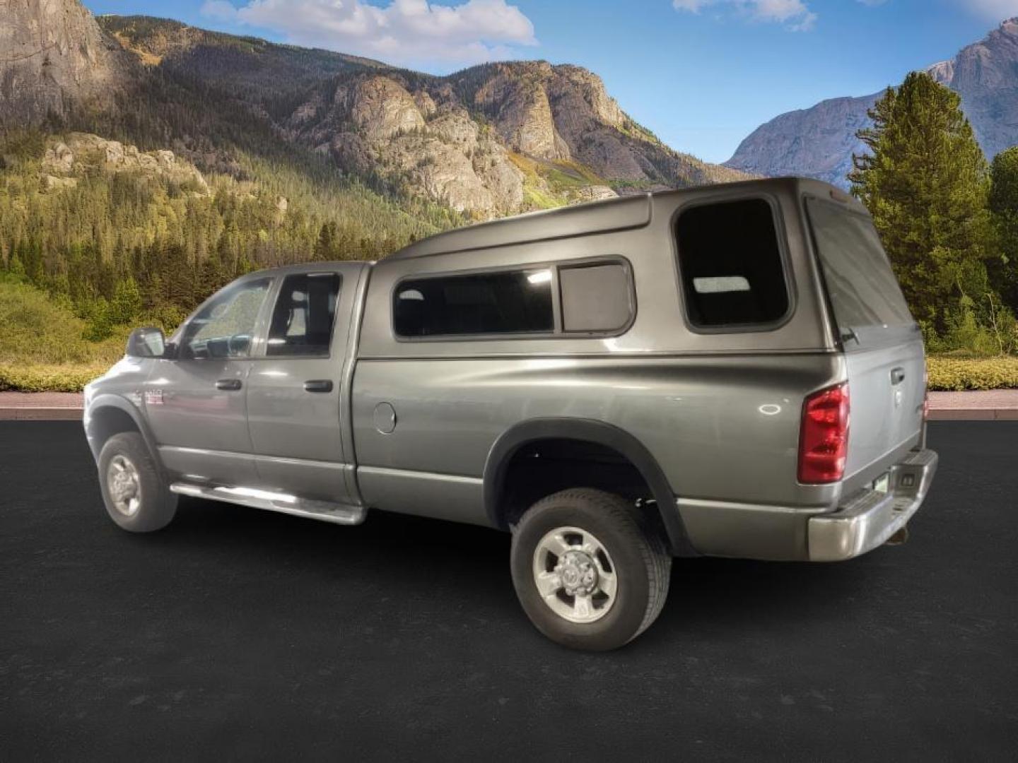 2007 GRAY /Medium Slate Gray Cloth Interior Dodge Ram 3500 SLT Quad Cab LWB 4WD DRW (3D7MX38C57G) with an 5.9L L6 OHV 24V TURBO DIESEL engine, 4-Speed Automatic transmission, located at 1235 N Woodruff Ave., Idaho Falls, 83401, (208) 523-1053, 43.507172, -112.000488 - At Timberline Auto, finding a great deal on your next vehicle is always easy! Our experienced sales staff's goal is to help find you the right vehicle at the right price! Our knowledgeable finance department has options for almost any credit score. We offer extended service contract options to prote - Photo#2
