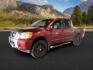 2014 Cayenne Red Metallic /Charcoal Nissan Titan SL Crew Cab 4WD (1N6AA0EC1EN) with an 5.6L V8 DOHC 32V engine, 5-Speed Automatic transmission, located at 1235 N Woodruff Ave., Idaho Falls, 83401, (208) 523-1053, 43.507172, -112.000488 - At Timberline Auto, finding a great deal on your next vehicle is always easy! Our experienced sales staff's goal is to help find you the right vehicle at the right price! Our knowledgeable finance department has options for almost any credit score. We offer extended service contract options to prote - Photo#0