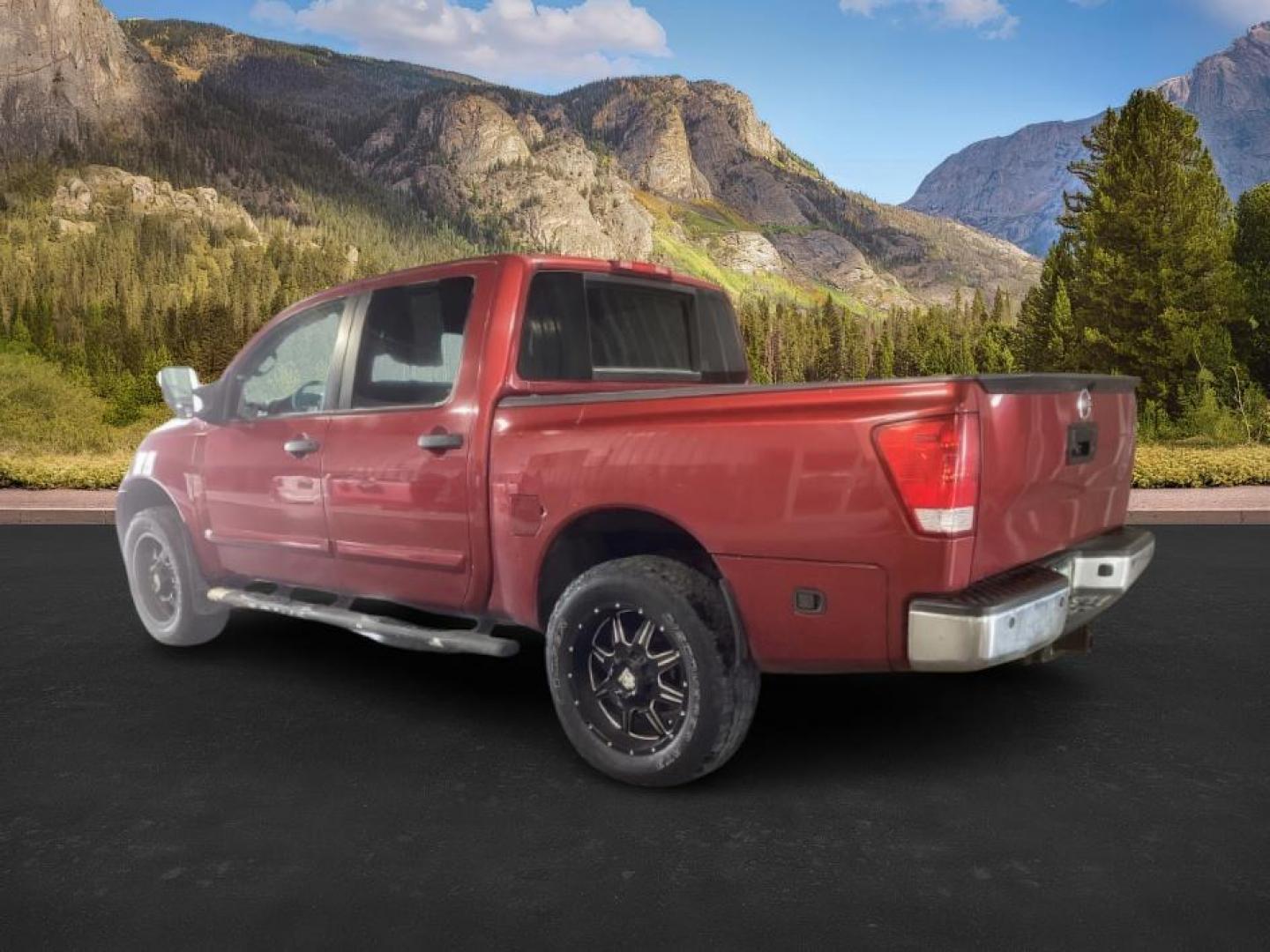 2014 Cayenne Red Metallic /Charcoal Nissan Titan SL Crew Cab 4WD (1N6AA0EC1EN) with an 5.6L V8 DOHC 32V engine, 5-Speed Automatic transmission, located at 1235 N Woodruff Ave., Idaho Falls, 83401, (208) 523-1053, 43.507172, -112.000488 - At Timberline Auto, finding a great deal on your next vehicle is always easy! Our experienced sales staff's goal is to help find you the right vehicle at the right price! Our knowledgeable finance department has options for almost any credit score. We offer extended service contract options to prote - Photo#2