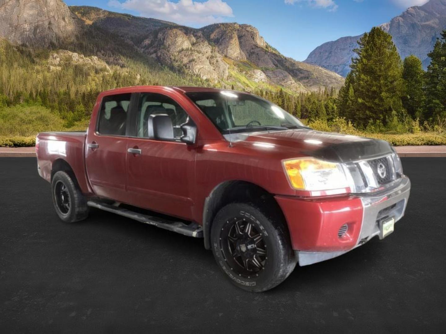 2014 Cayenne Red Metallic /Charcoal Nissan Titan SL Crew Cab 4WD (1N6AA0EC1EN) with an 5.6L V8 DOHC 32V engine, 5-Speed Automatic transmission, located at 1235 N Woodruff Ave., Idaho Falls, 83401, (208) 523-1053, 43.507172, -112.000488 - At Timberline Auto, finding a great deal on your next vehicle is always easy! Our experienced sales staff's goal is to help find you the right vehicle at the right price! Our knowledgeable finance department has options for almost any credit score. We offer extended service contract options to prote - Photo#5
