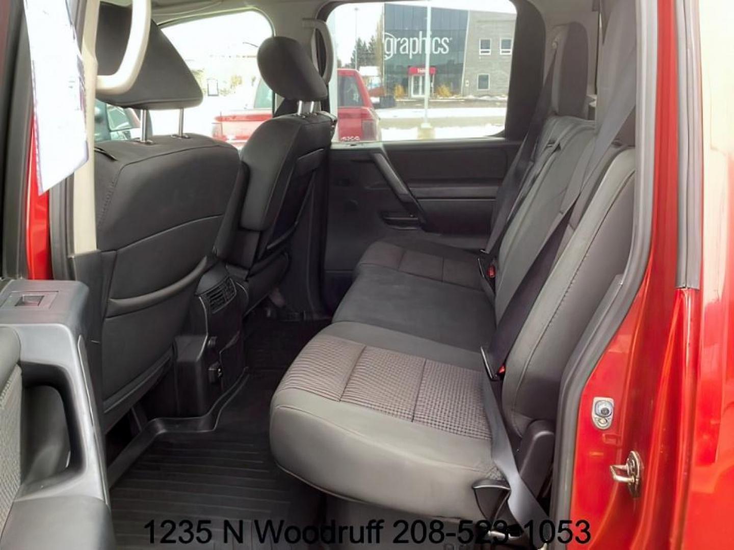 2014 Cayenne Red Metallic /Charcoal Nissan Titan SL Crew Cab 4WD (1N6AA0EC1EN) with an 5.6L V8 DOHC 32V engine, 5-Speed Automatic transmission, located at 1235 N Woodruff Ave., Idaho Falls, 83401, (208) 523-1053, 43.507172, -112.000488 - At Timberline Auto, finding a great deal on your next vehicle is always easy! Our experienced sales staff's goal is to help find you the right vehicle at the right price! Our knowledgeable finance department has options for almost any credit score. We offer extended service contract options to prote - Photo#15