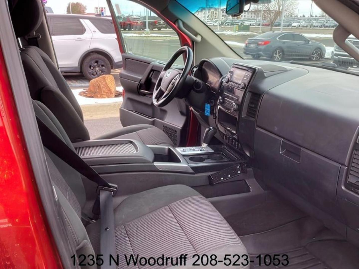 2014 Cayenne Red Metallic /Charcoal Nissan Titan SL Crew Cab 4WD (1N6AA0EC1EN) with an 5.6L V8 DOHC 32V engine, 5-Speed Automatic transmission, located at 1235 N Woodruff Ave., Idaho Falls, 83401, (208) 523-1053, 43.507172, -112.000488 - At Timberline Auto, finding a great deal on your next vehicle is always easy! Our experienced sales staff's goal is to help find you the right vehicle at the right price! Our knowledgeable finance department has options for almost any credit score. We offer extended service contract options to prote - Photo#17