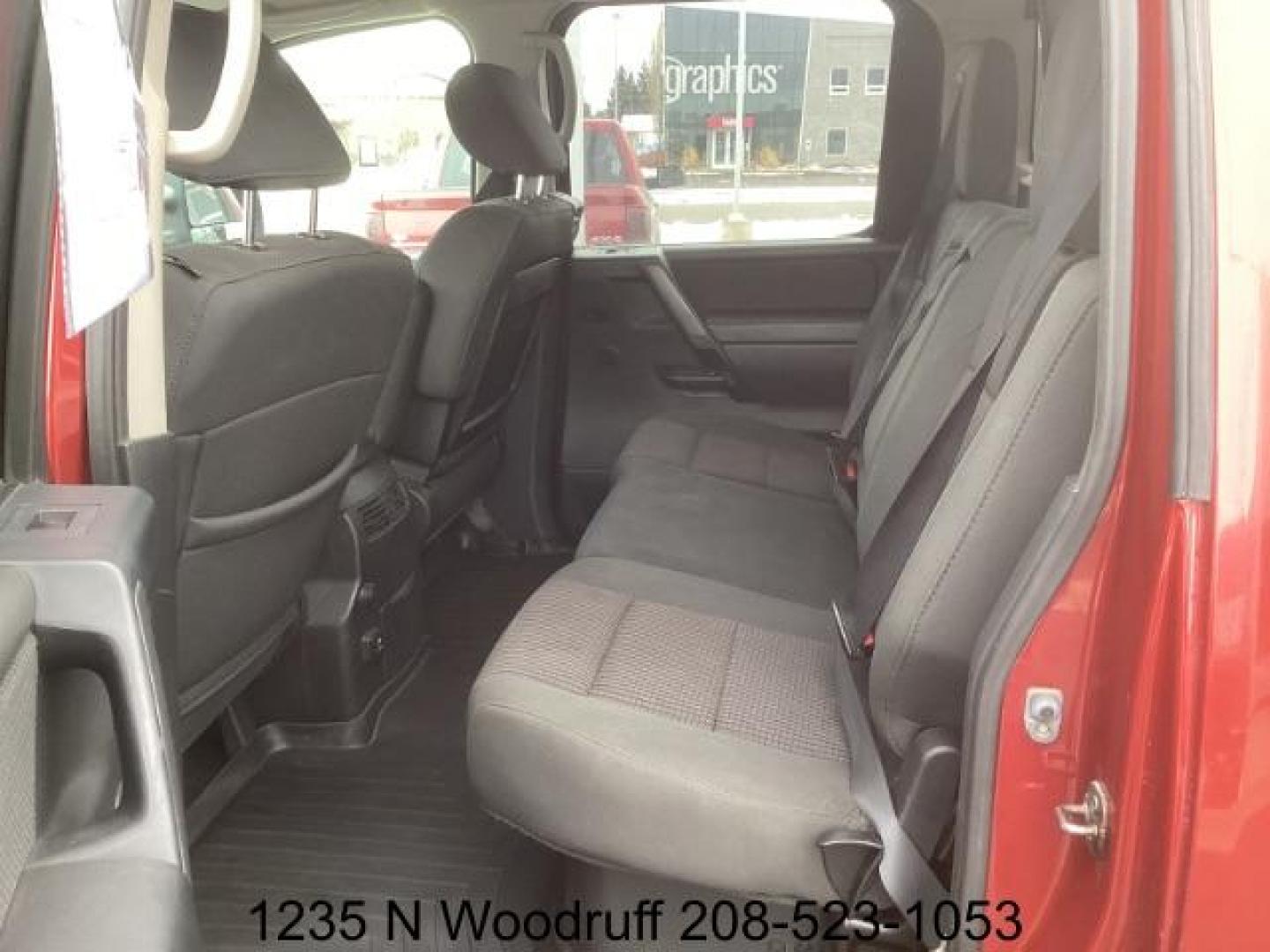 2014 Cayenne Red Metallic /Charcoal Nissan Titan SL Crew Cab 4WD (1N6AA0EC1EN) with an 5.6L V8 DOHC 32V engine, 5-Speed Automatic transmission, located at 1235 N Woodruff Ave., Idaho Falls, 83401, (208) 523-1053, 43.507172, -112.000488 - At Timberline Auto, finding a great deal on your next vehicle is always easy! Our experienced sales staff's goal is to help find you the right vehicle at the right price! Our knowledgeable finance department has options for almost any credit score. We offer extended service contract options to prote - Photo#15